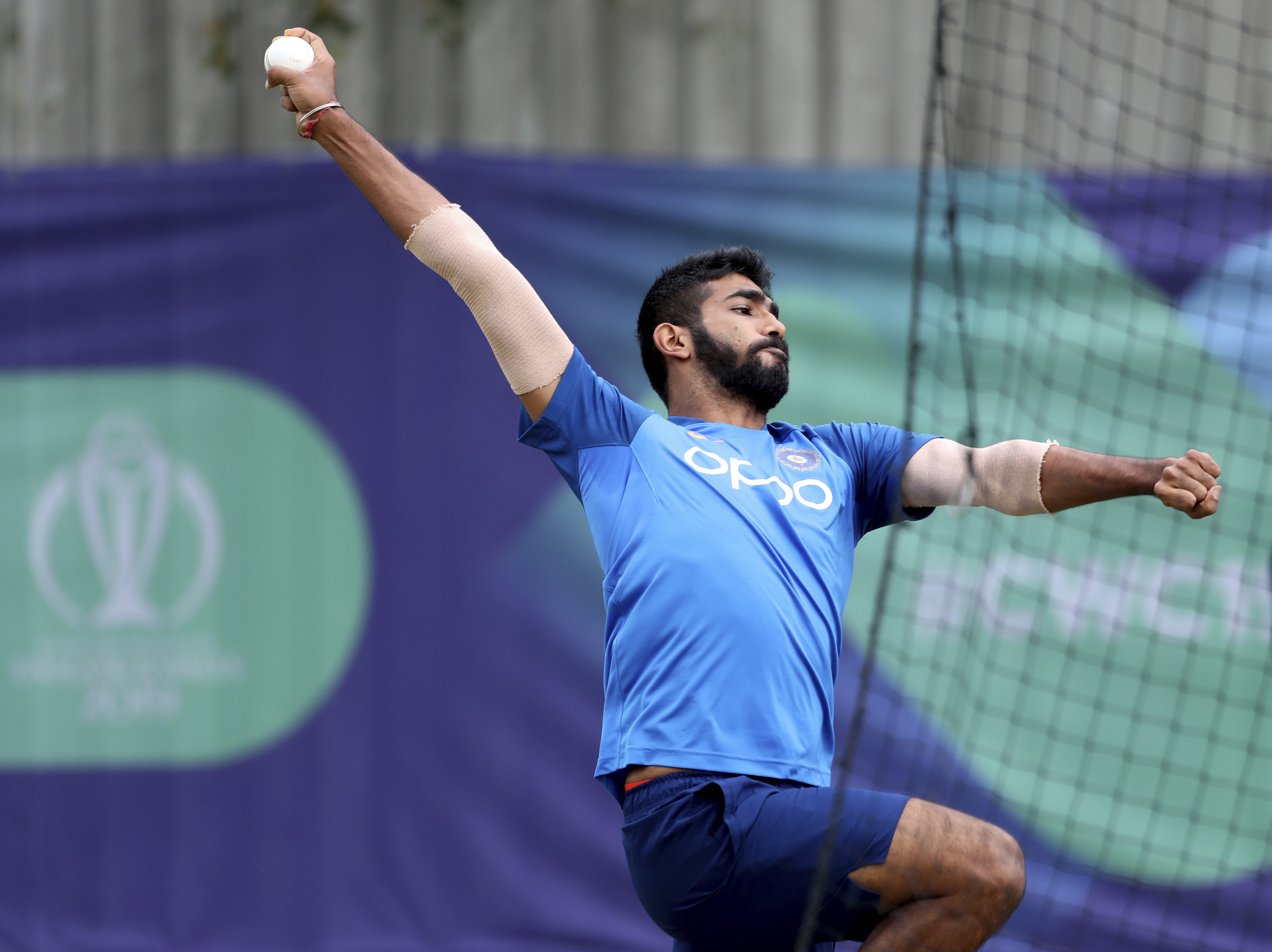 The Latest: India's Bumrah OK to share new ball with Shami