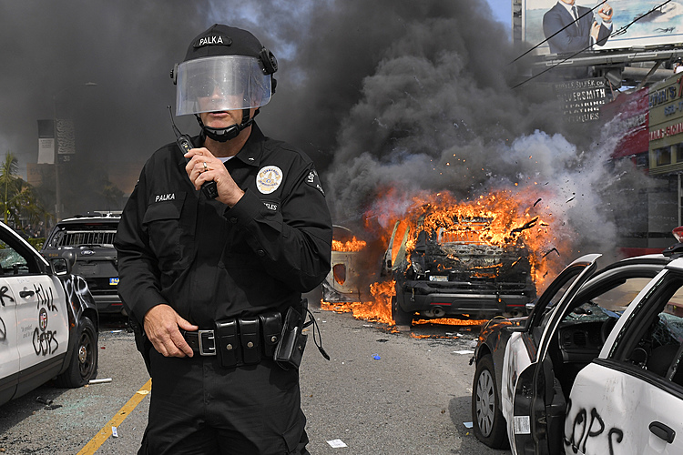The Latest: Chicago mayor restricts vehicle, transit access