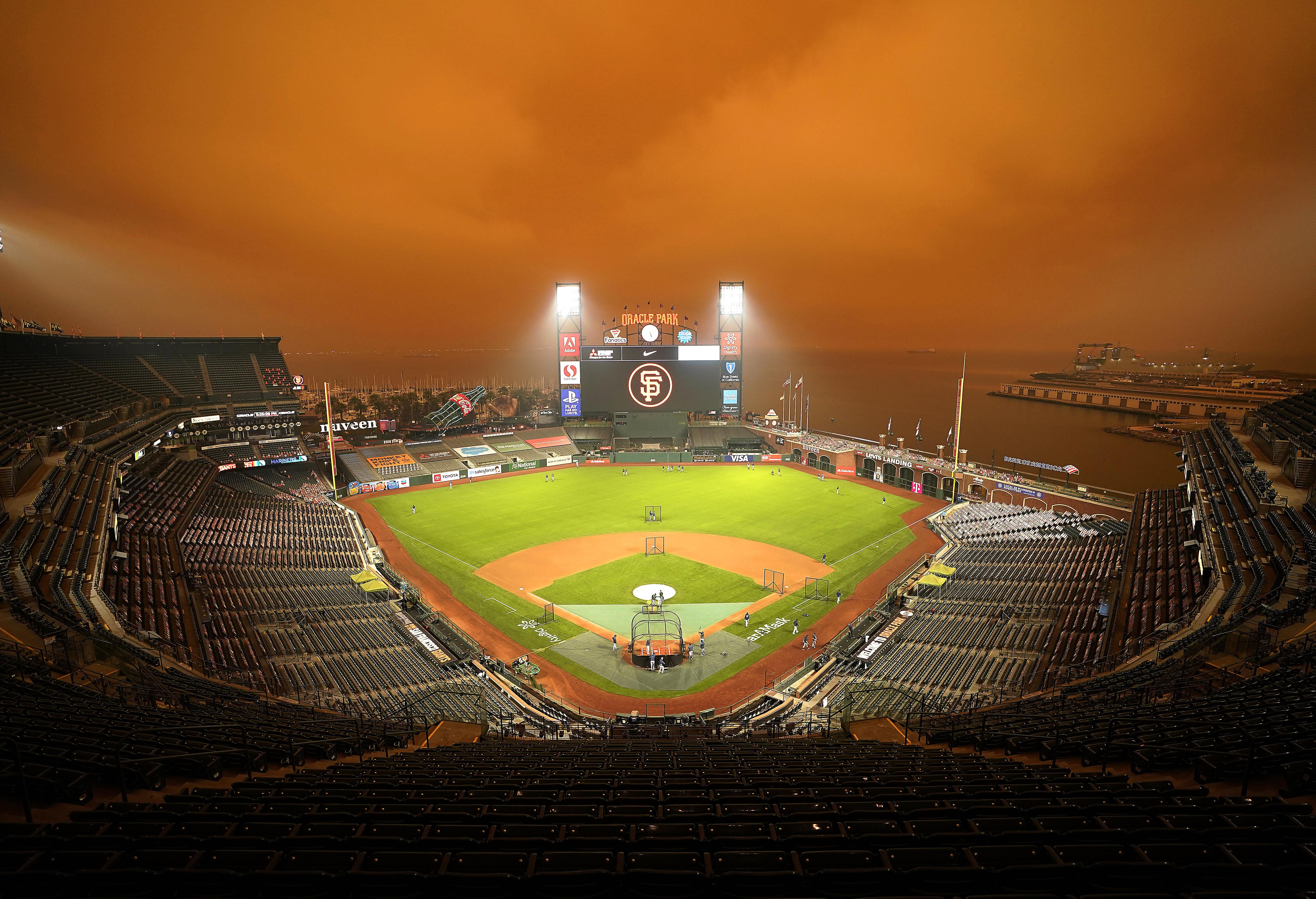 Smoke from nearby wildfires creates eerie baseball scene