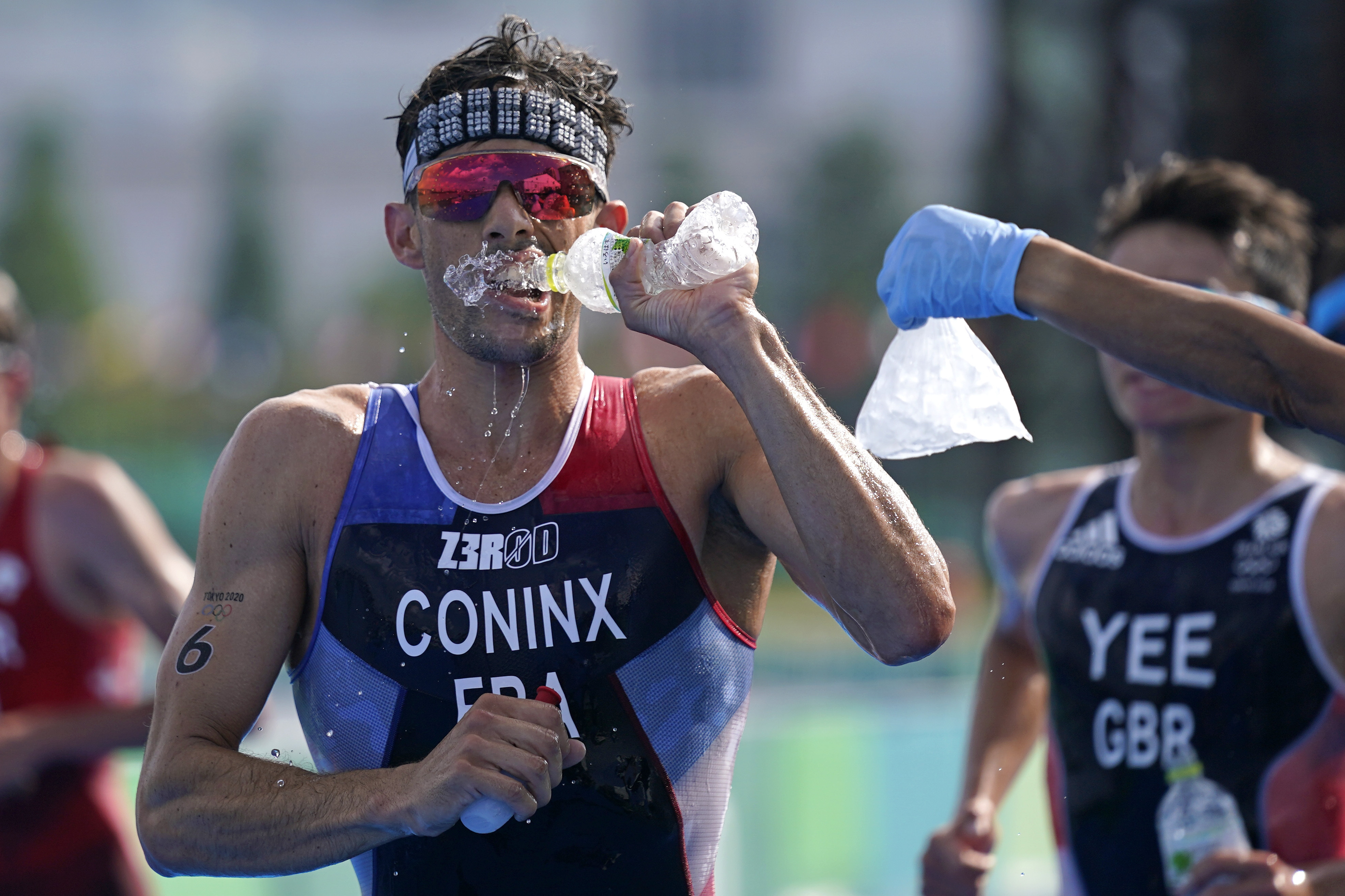 Pandemic Olympics endured heat, and now a typhoon's en route