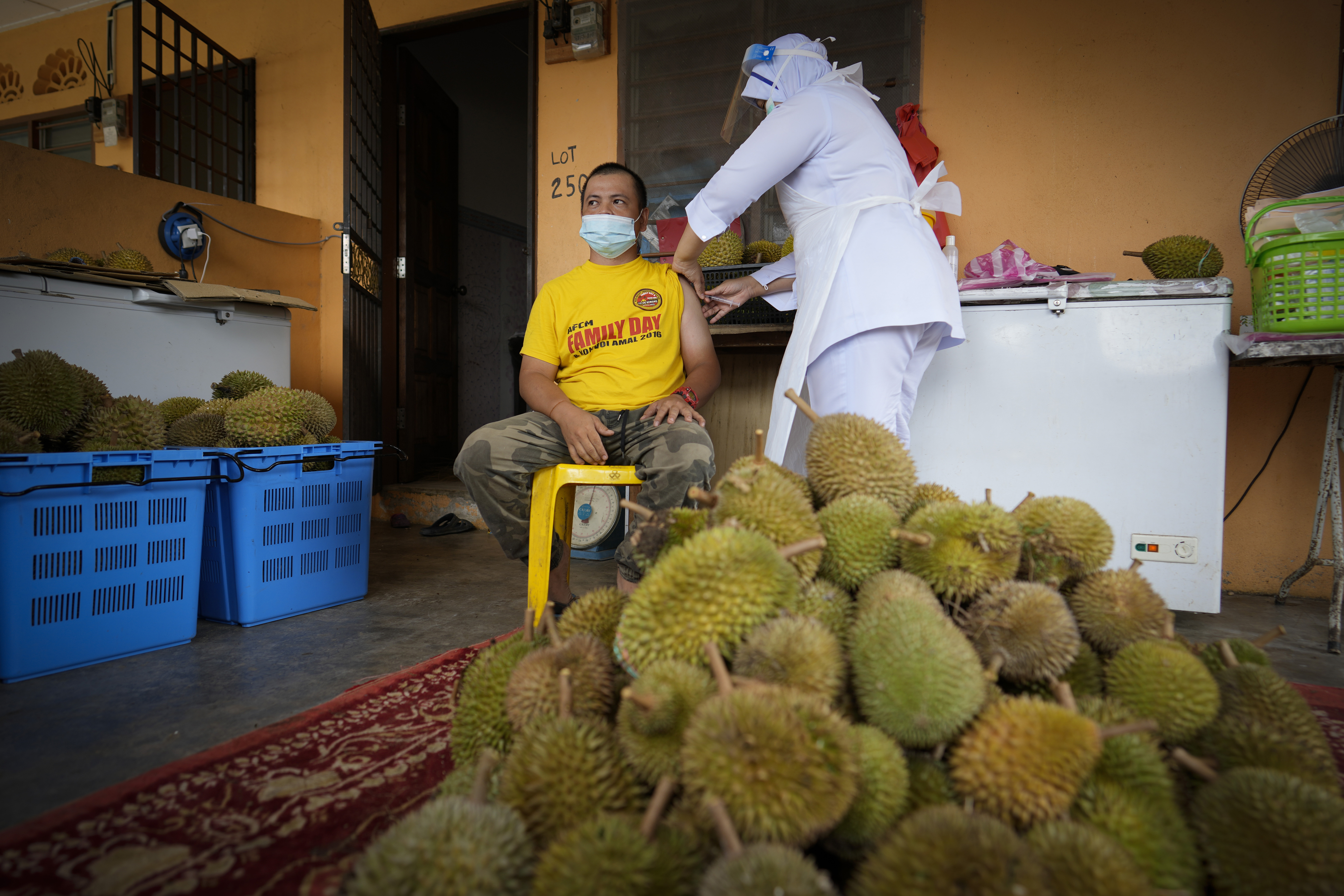 The Latest: Malaysia’s daily coronavirus cases top 20,000 