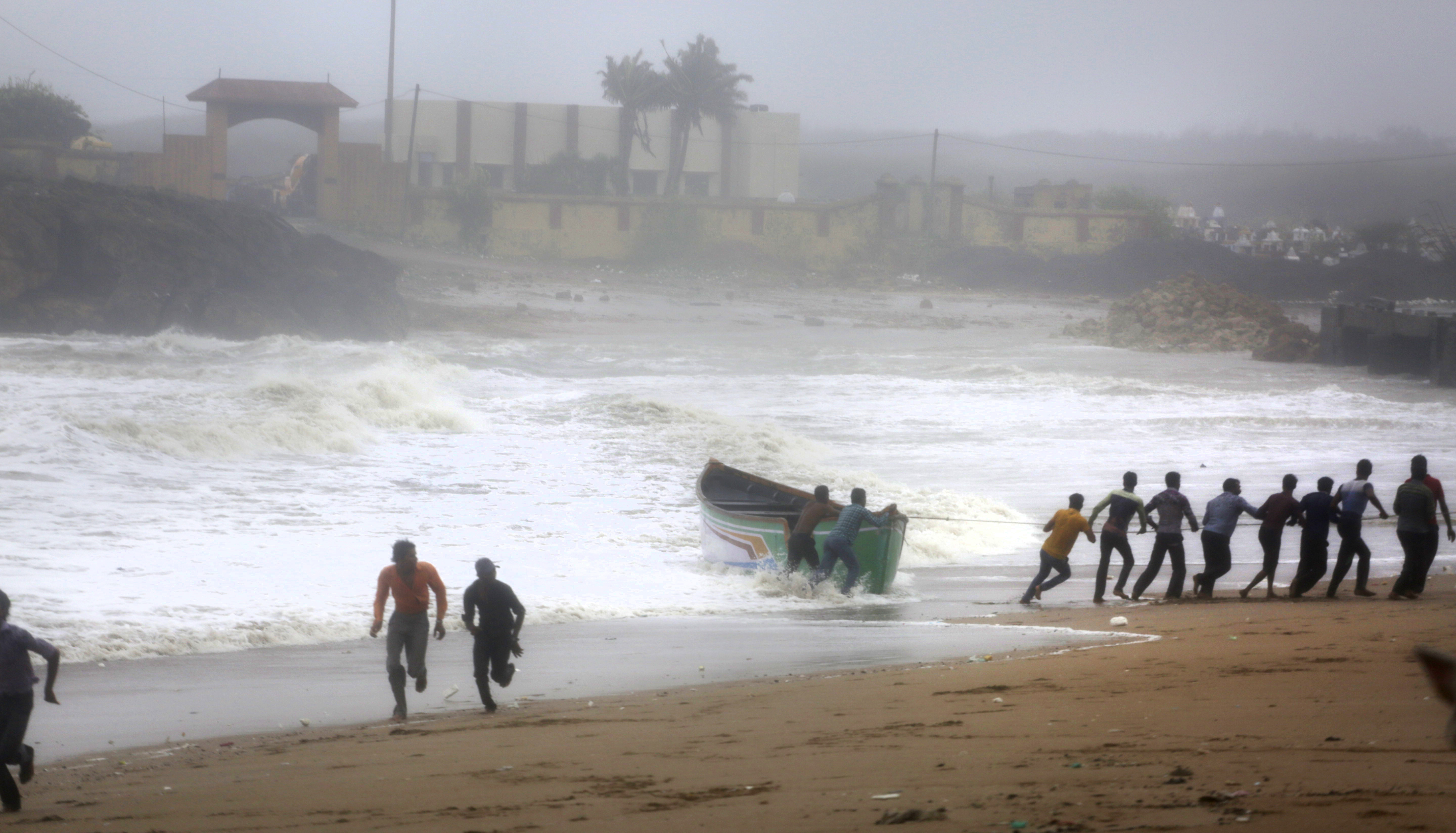 Cyclone batters fishing hub but veers away from Indian coast