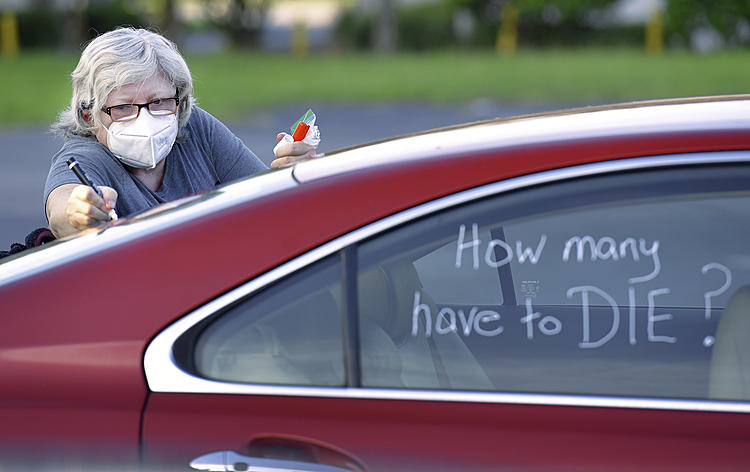 The Latest: Parents in Florida want schools open when 'safe'