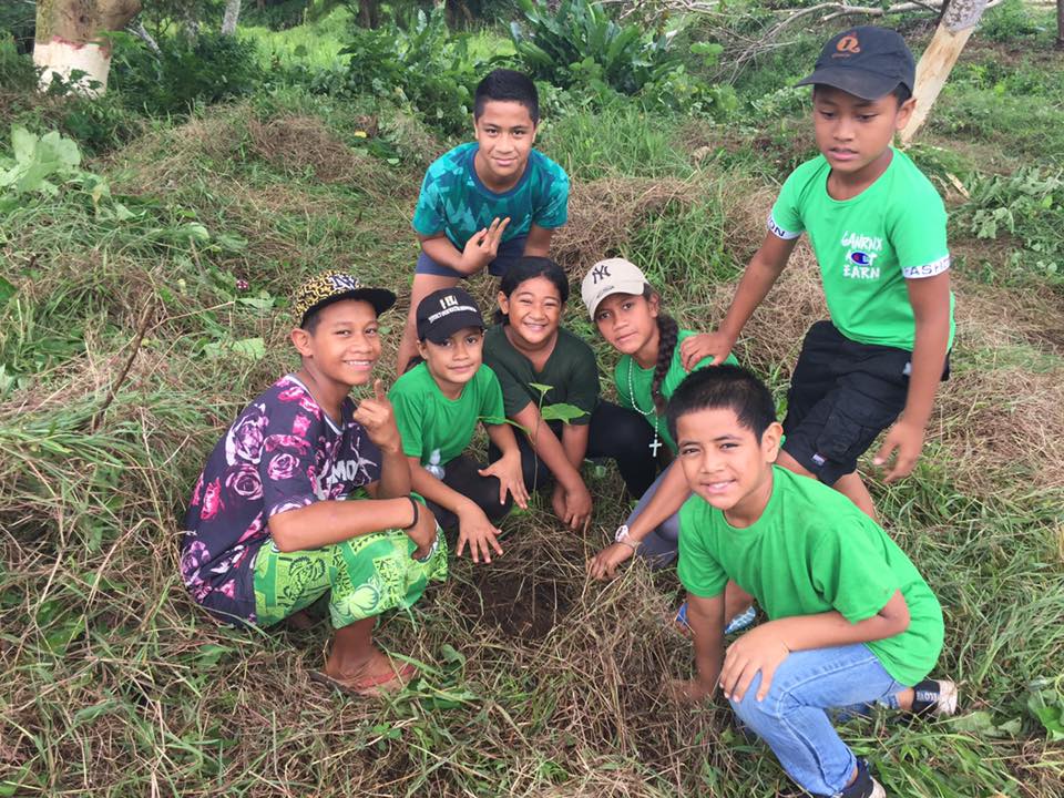 Students plant trees as part of literacy week
