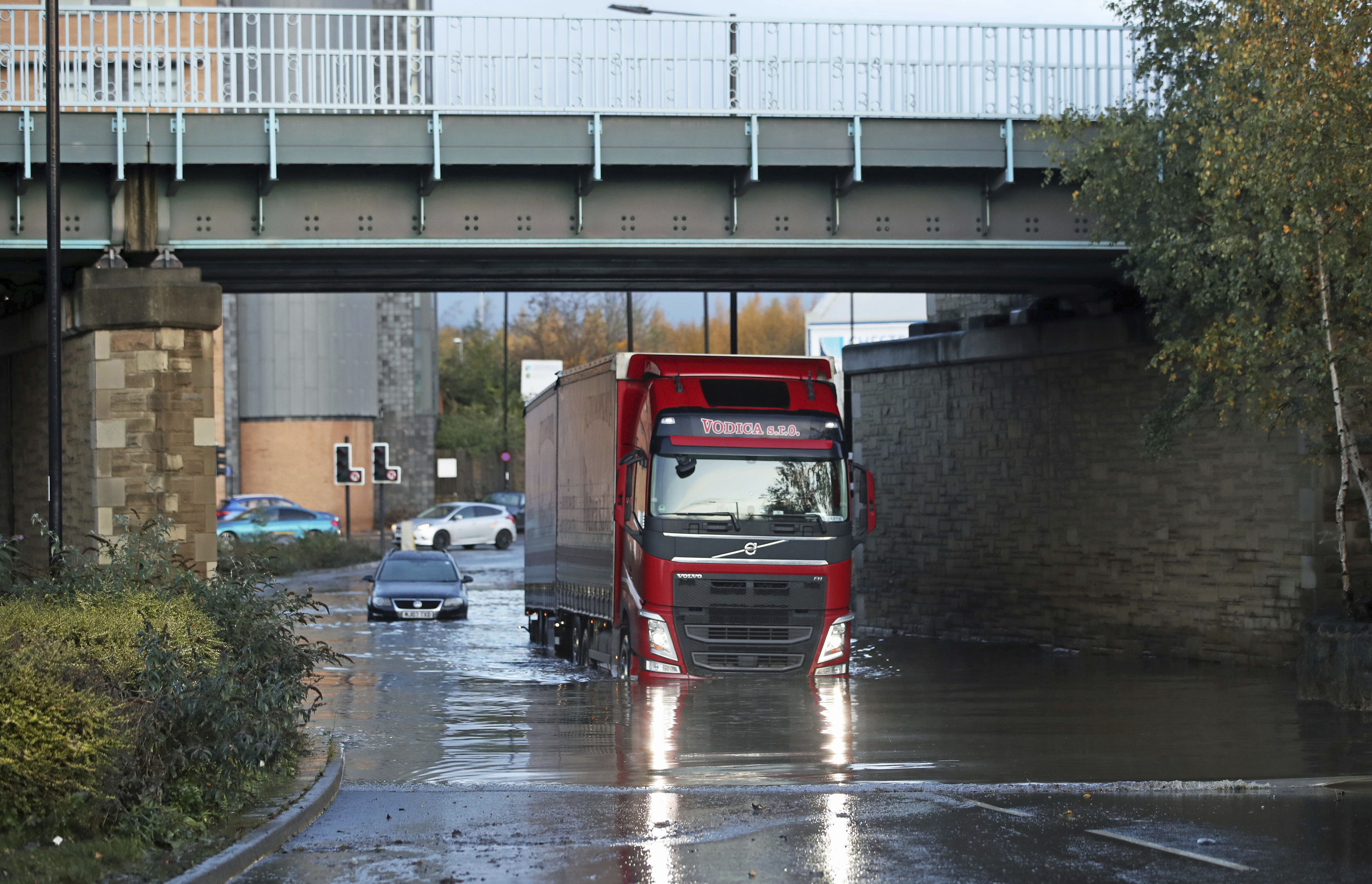 Torrential rain in England strands shoppers, floods streets