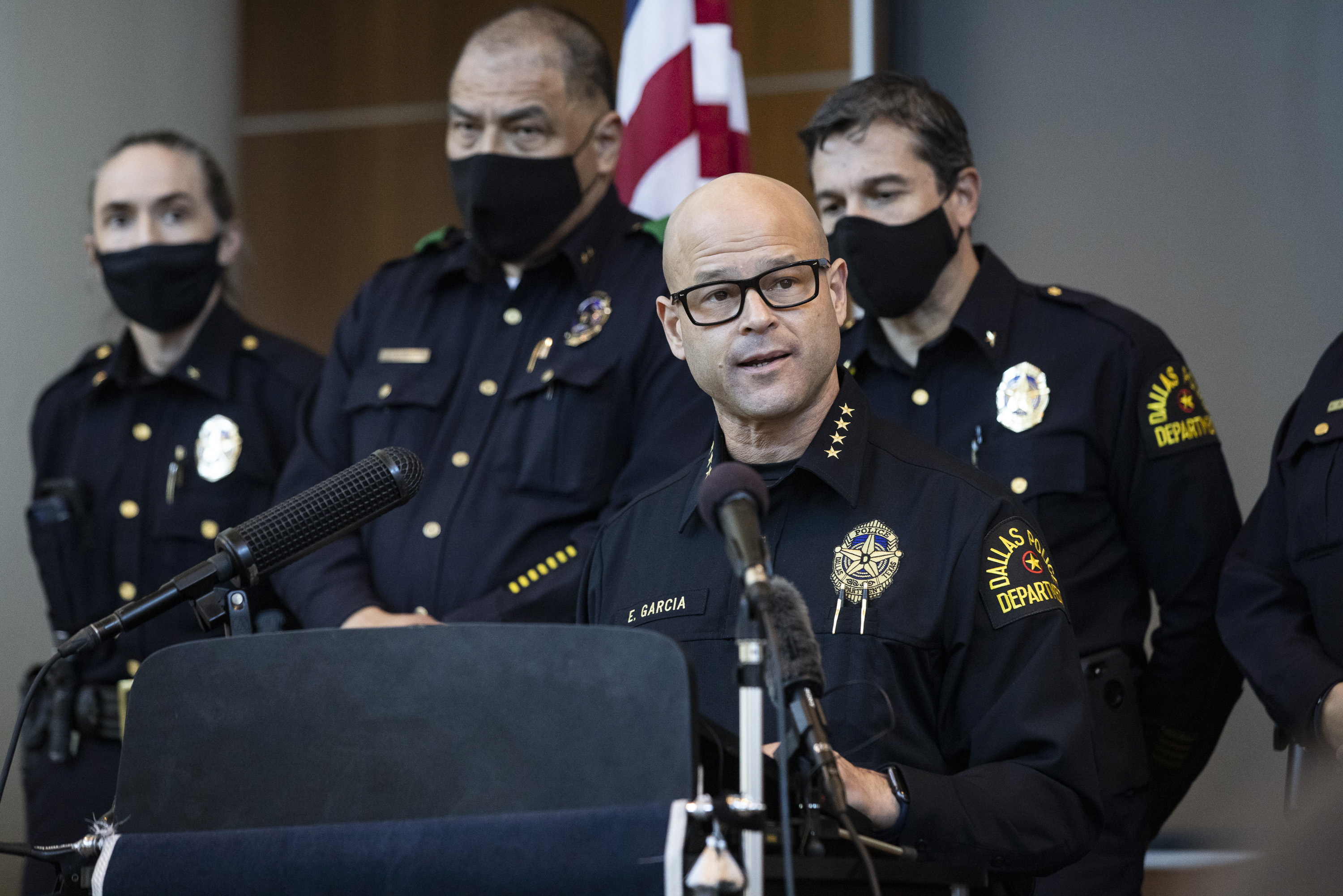 Dallas police officer charged with arranging two killings