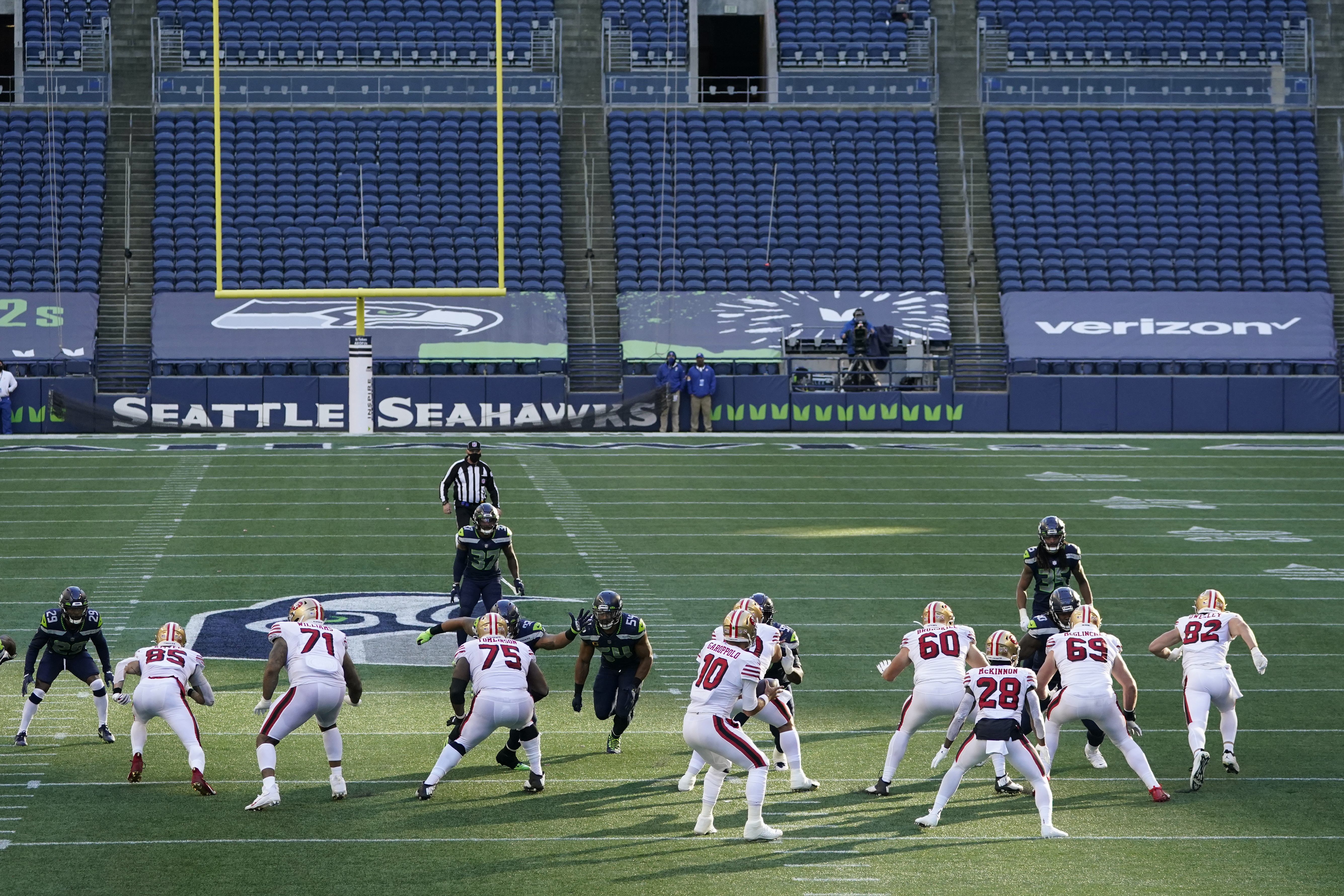 The Latest: Seahawks to continue playing in empty stadium