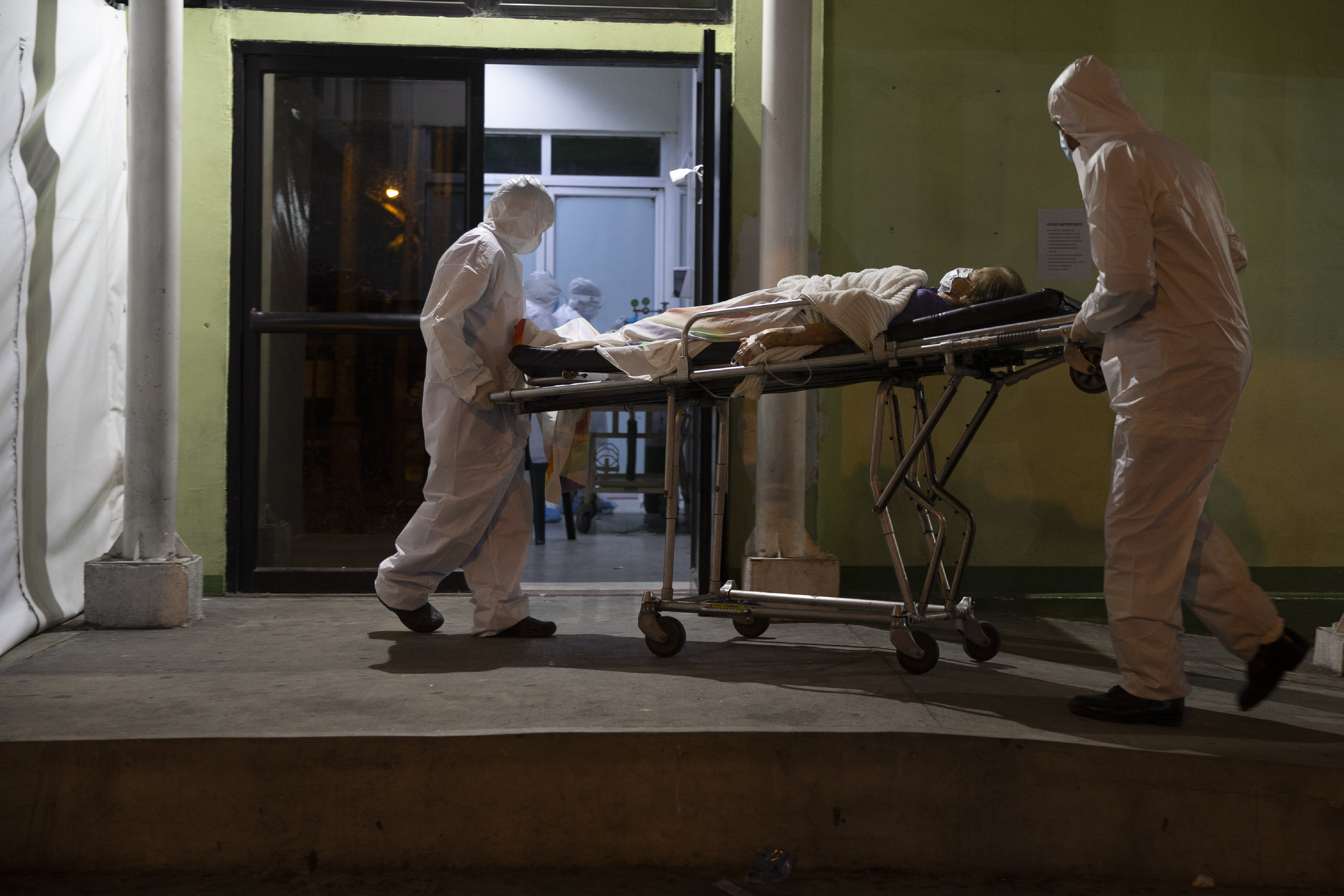 The Latest: Beijing locks down residential communities