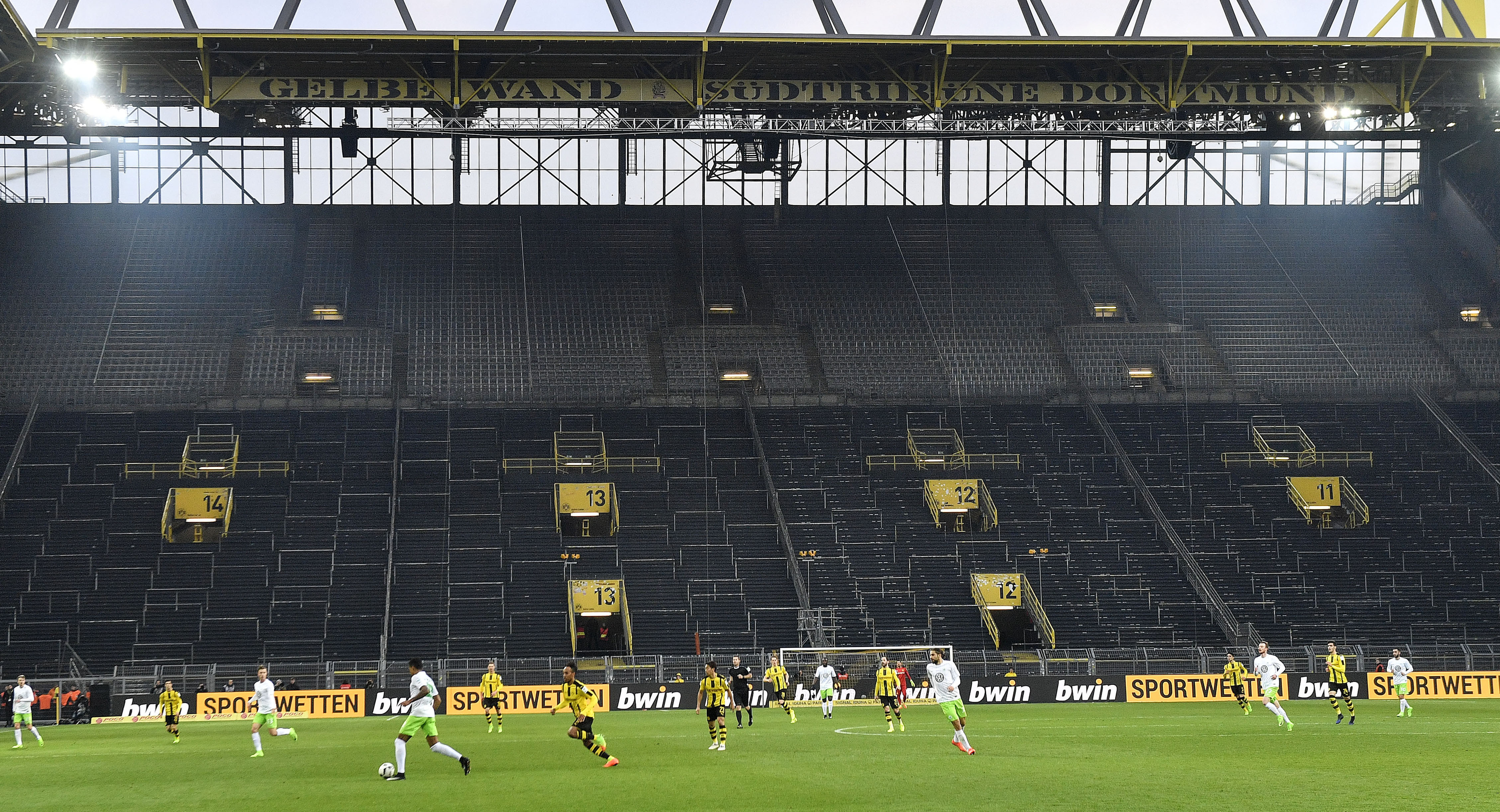 The Latest: China's football association to cut pay