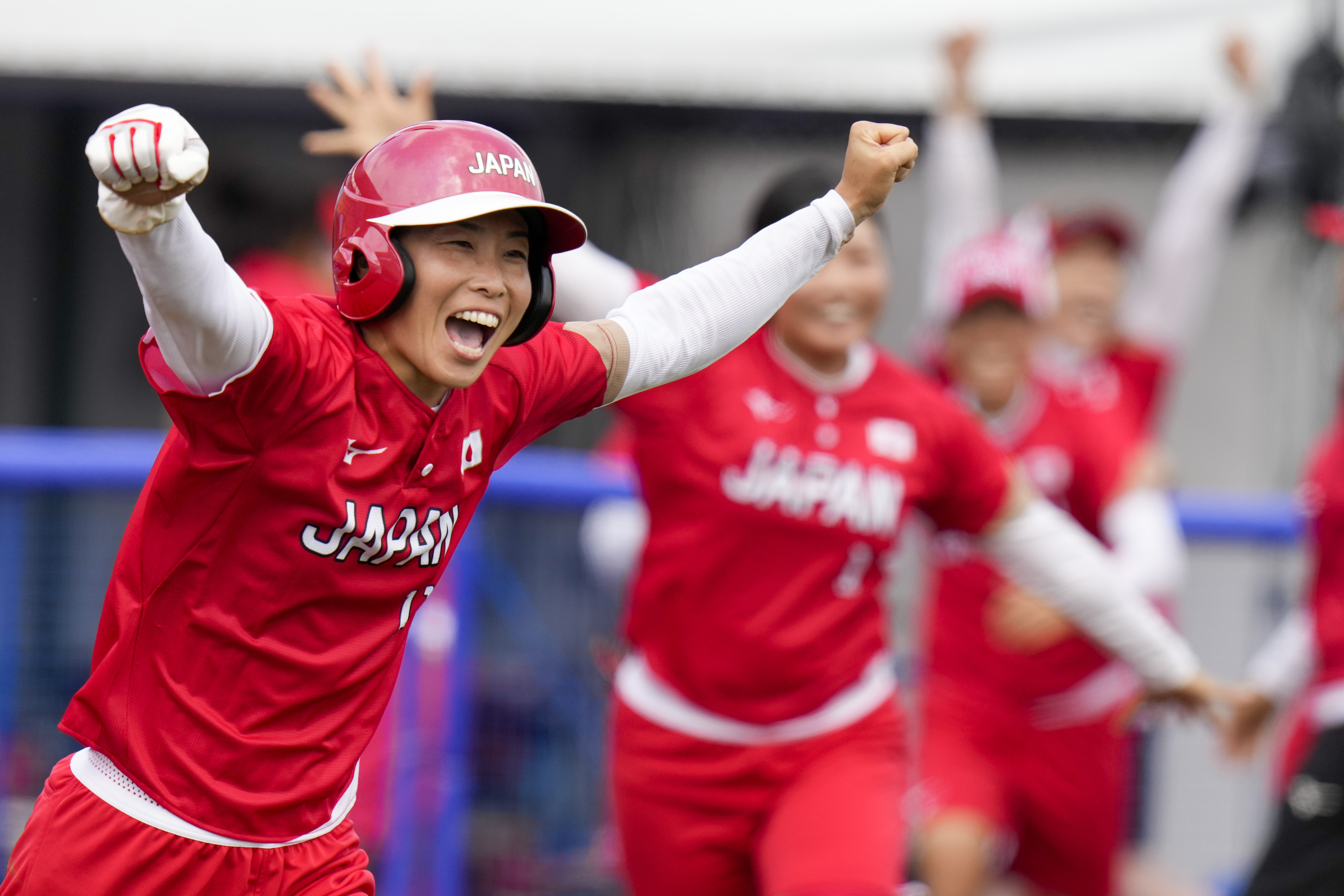 The Latest: Japan improves to 2-0 with Olympic softball win