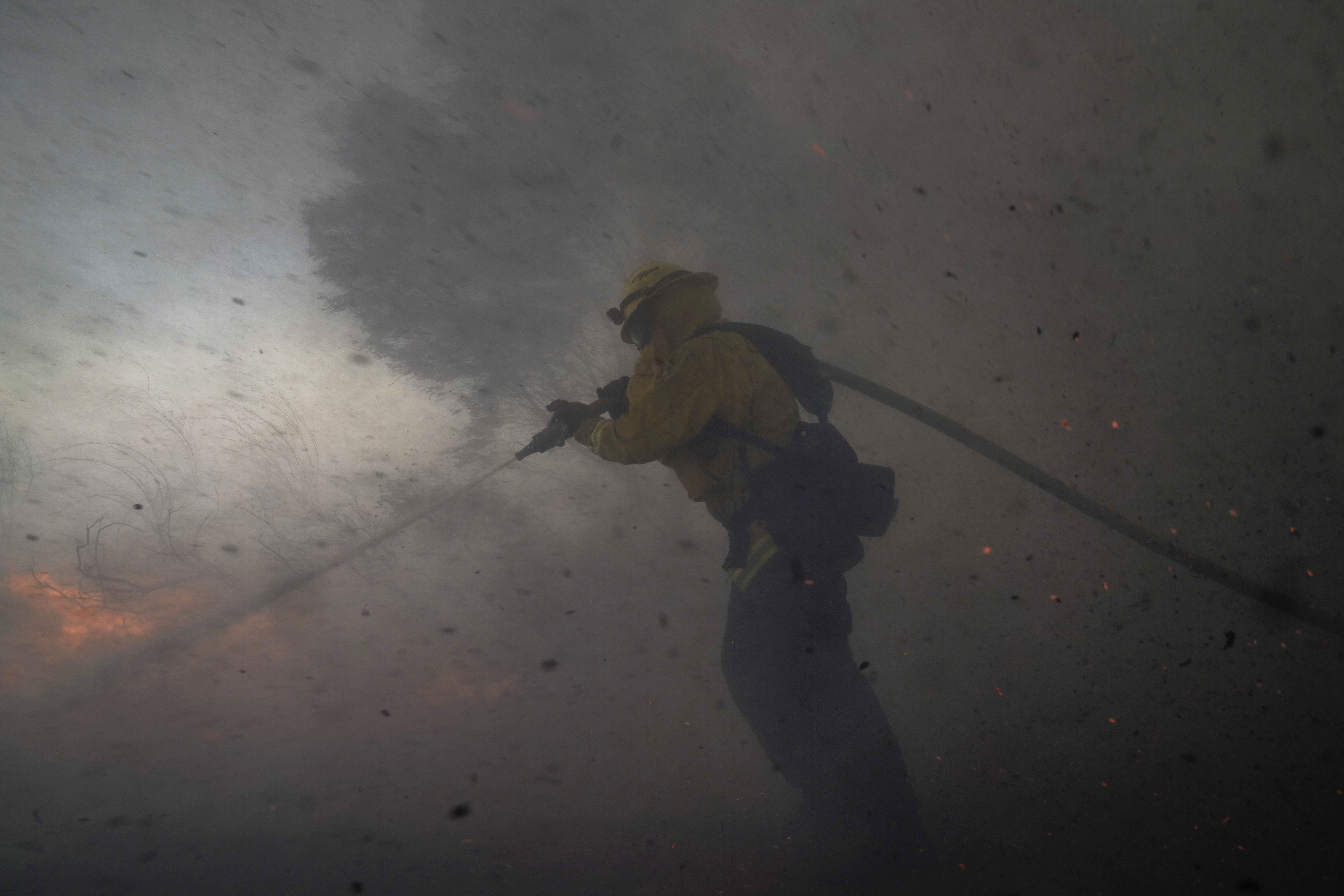 AP PHOTOS: Wind-whipped wildfires clobber California again