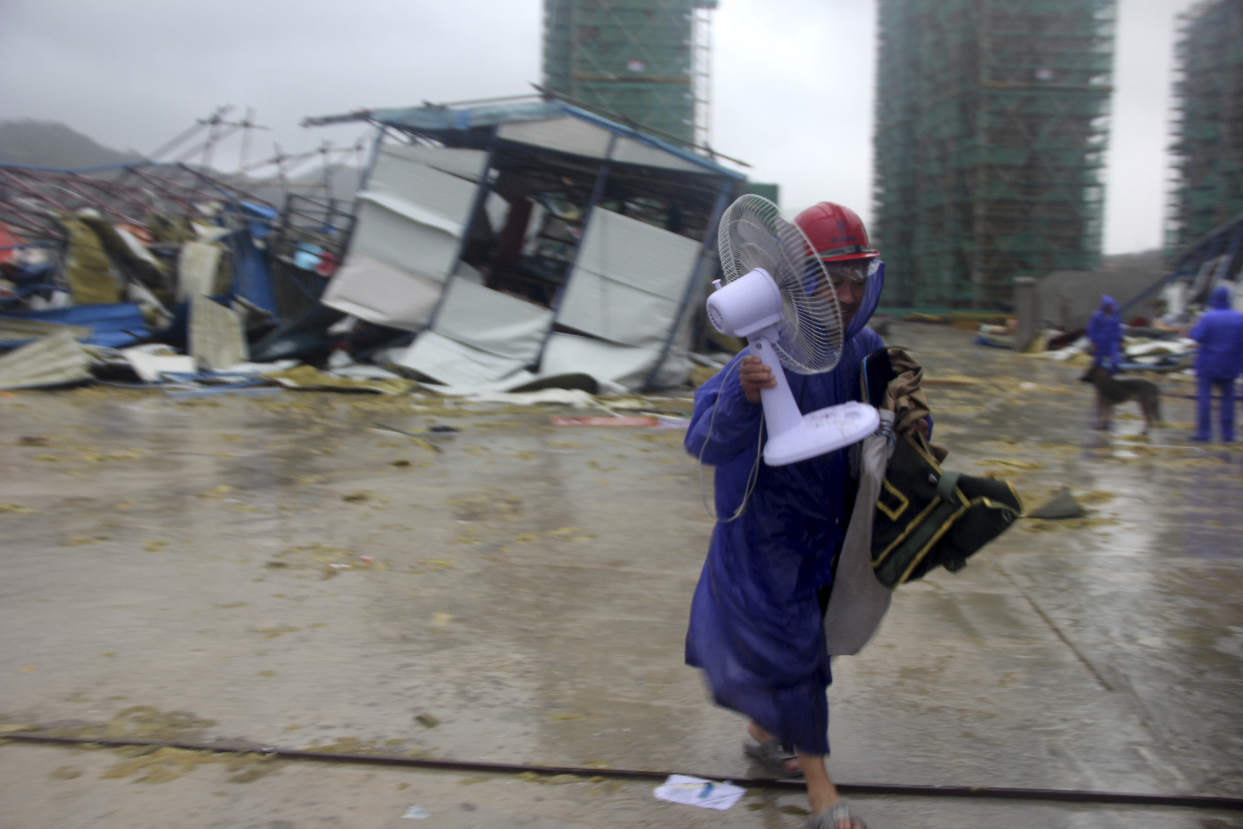 Chinese state TV: At least 13 dead in typhoon, 16 missing