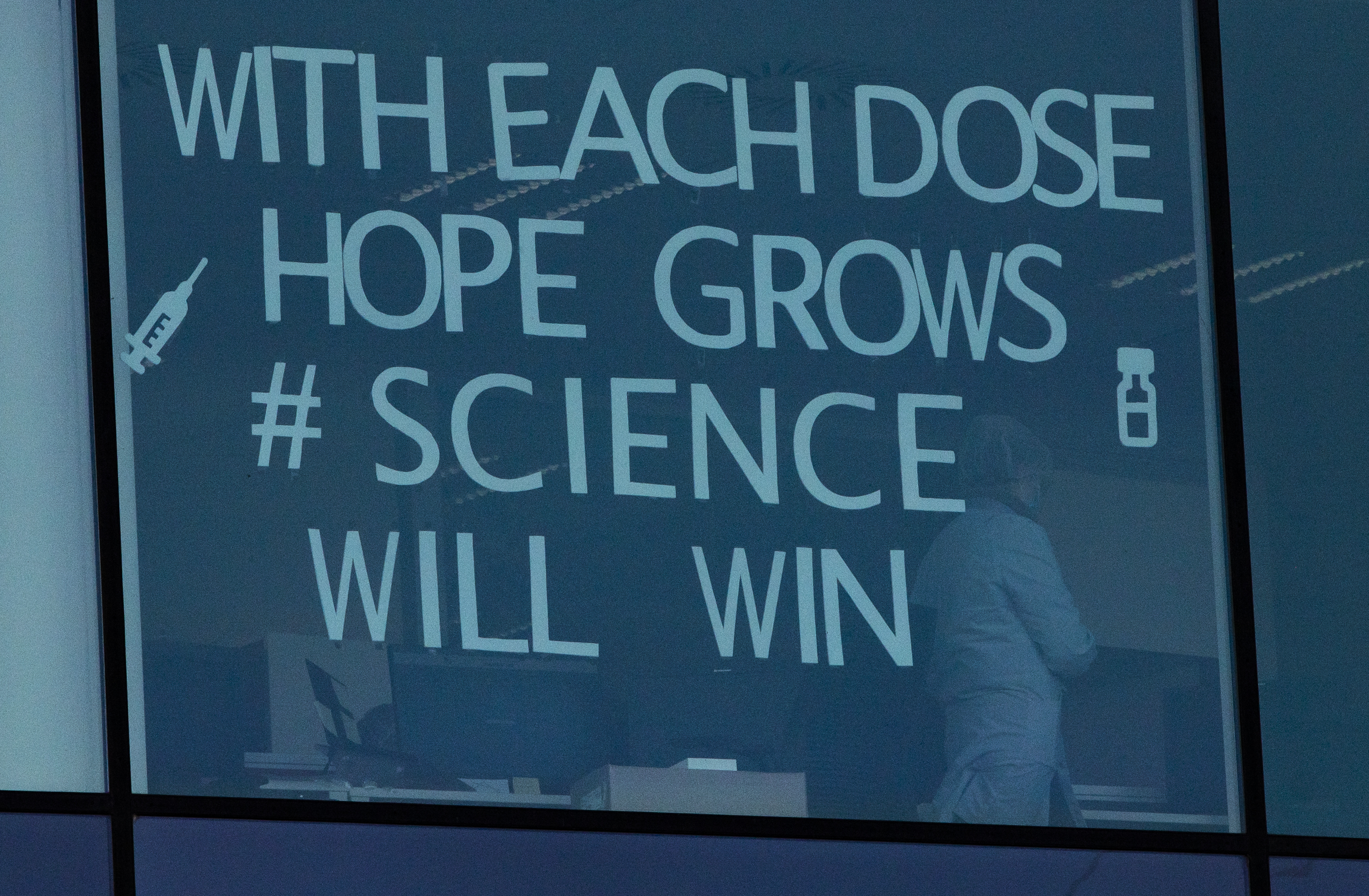 The Latest:  Pfizer studying effects of 3rd vaccine dose 