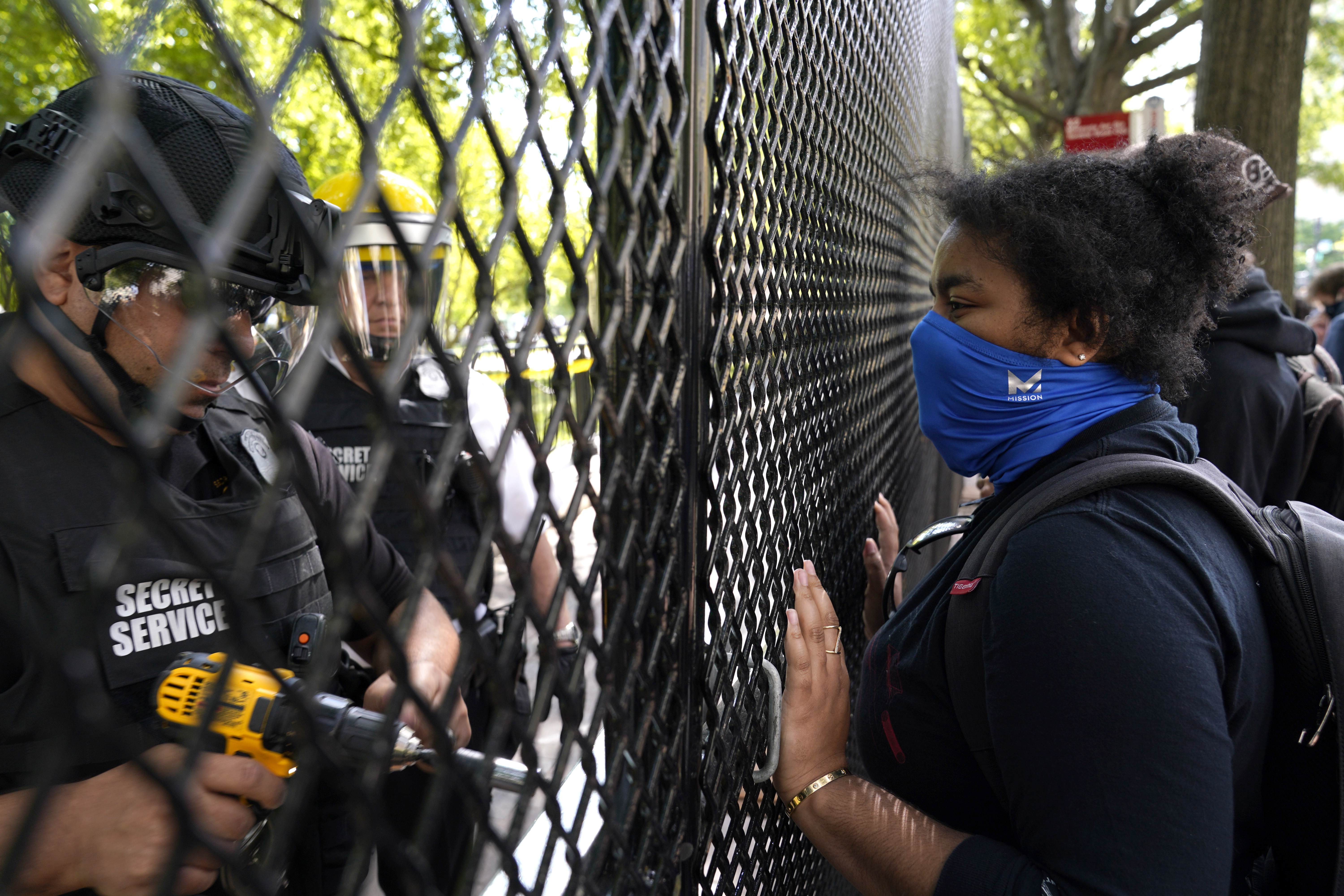 The Latest: Thousands protest across from Lafayette Park
