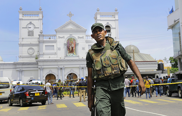The Latest: Sri Lanka invokes war-time military powers