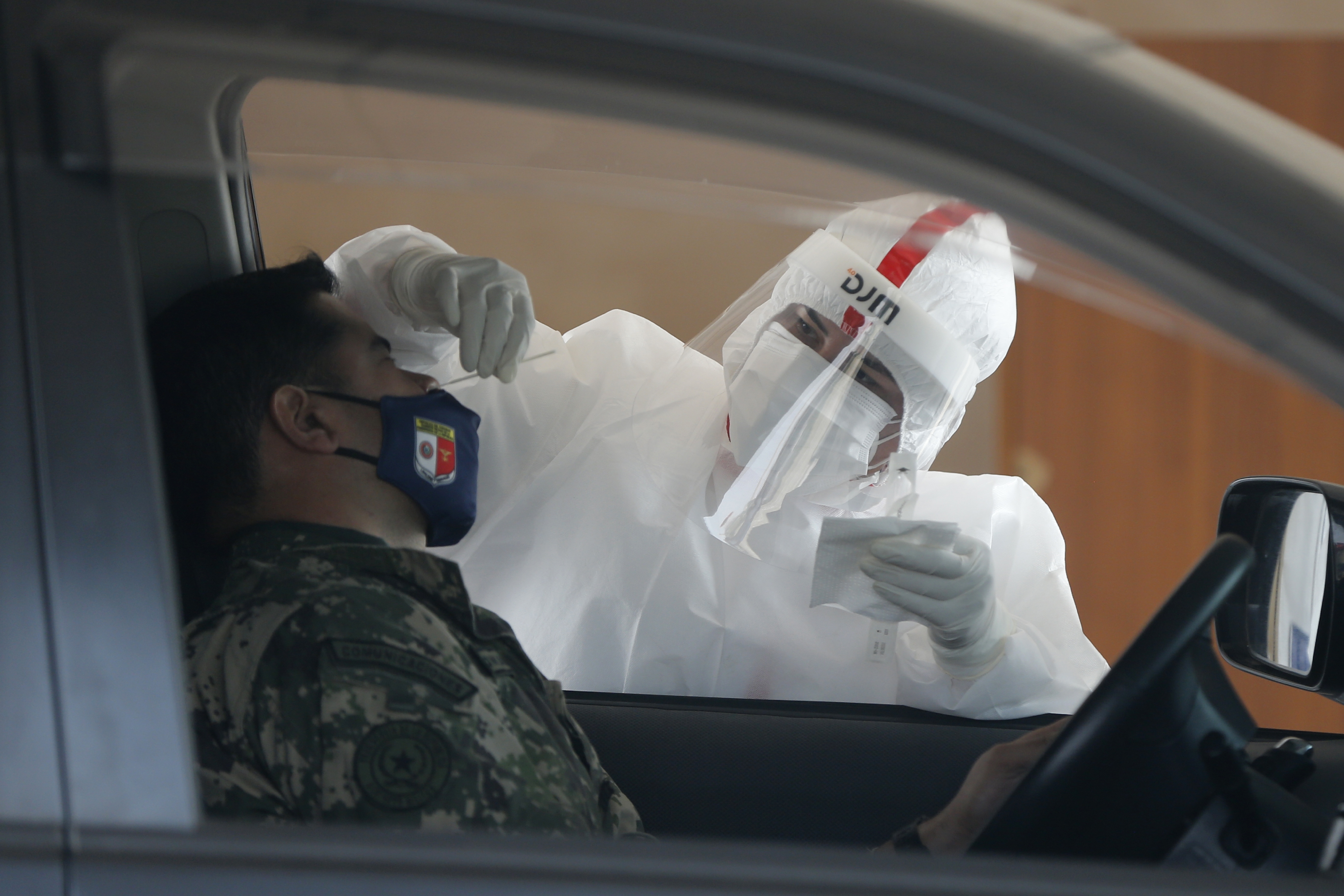 The Latest: Global health agency urges vaccine safety trials