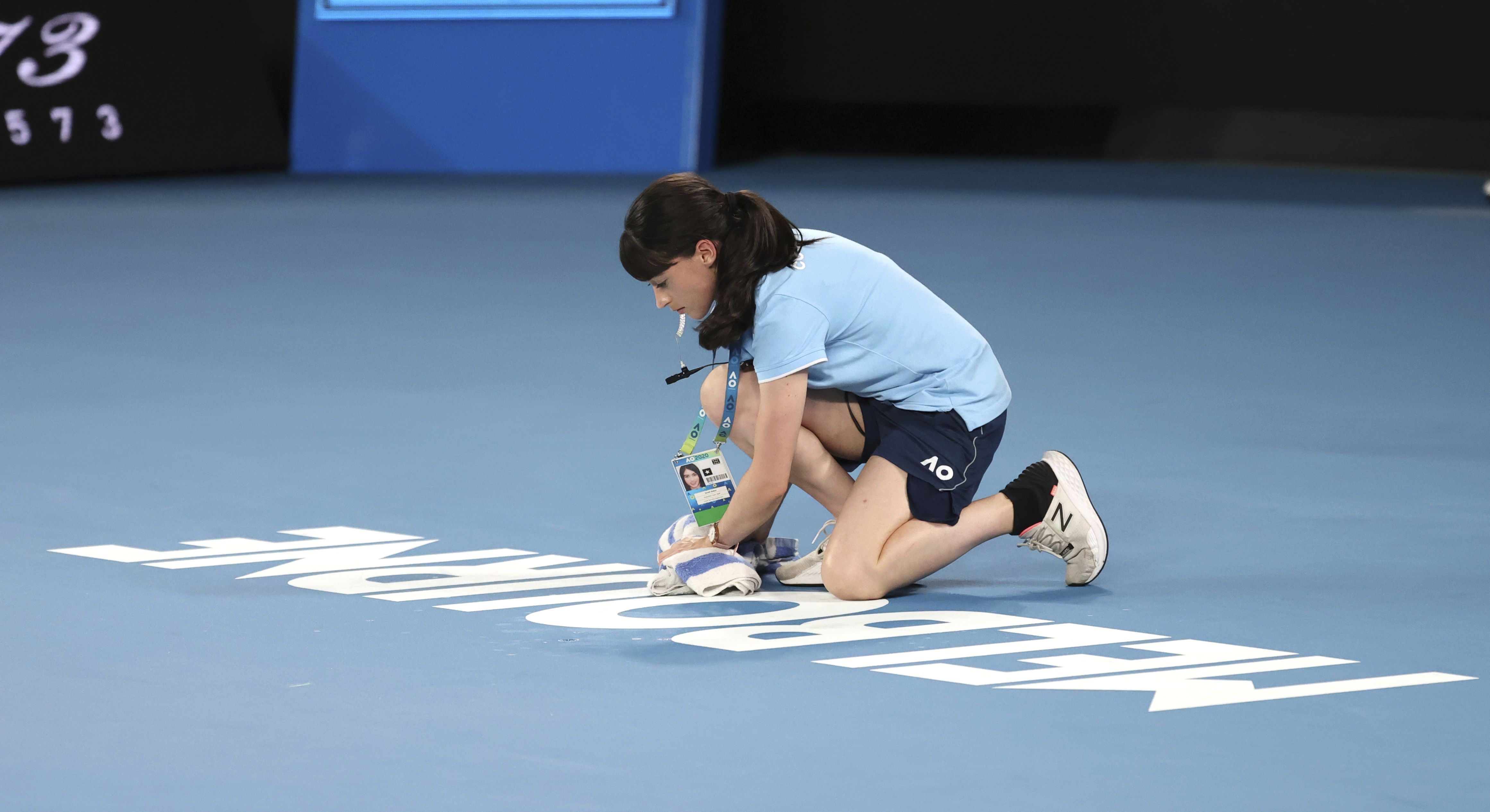The Latest: Leaky roof on Rod Laver has ball kids mopping up