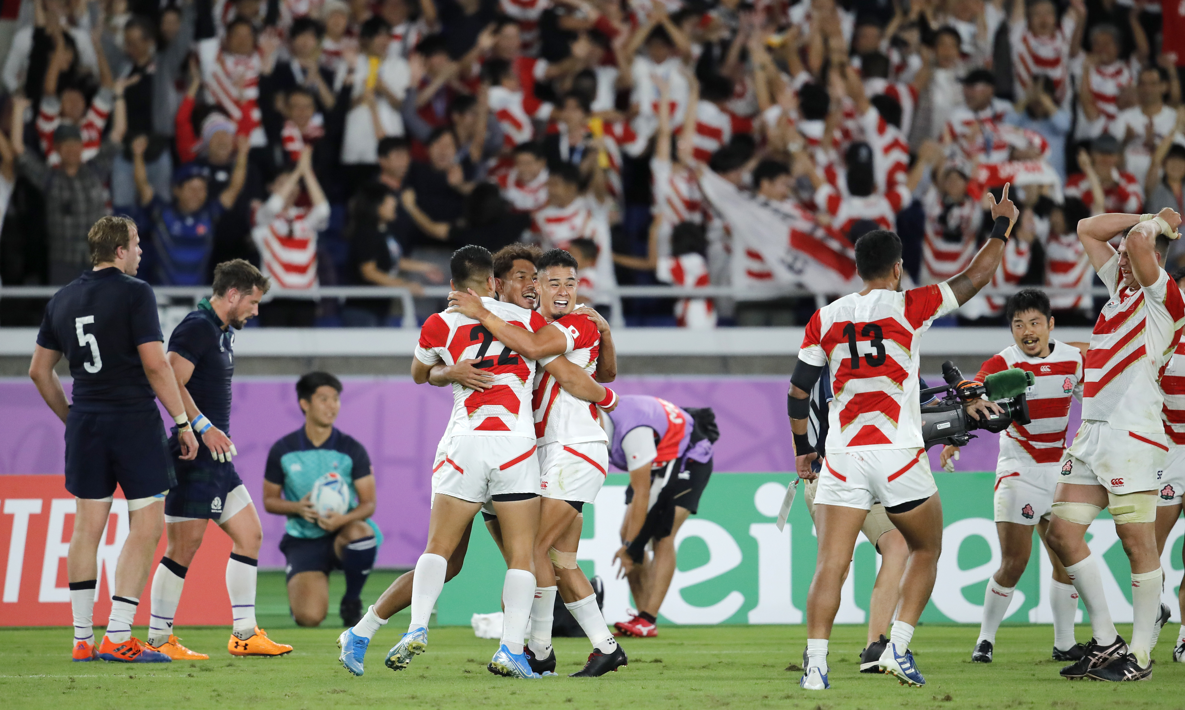 The Latest: Japan reaches first World Cup quarterfinal