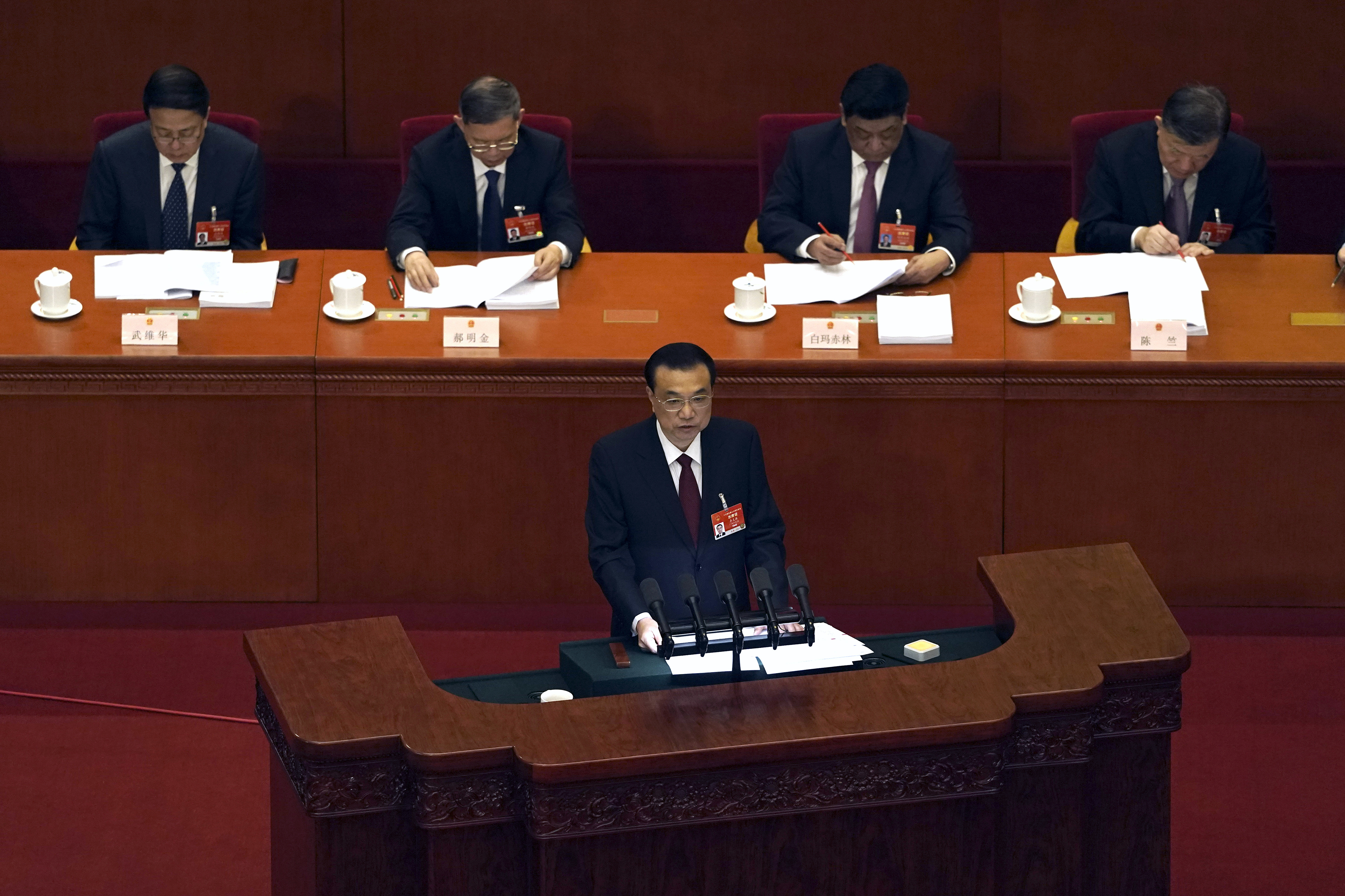 China sets growth target 'over 6%,' tightening HK control