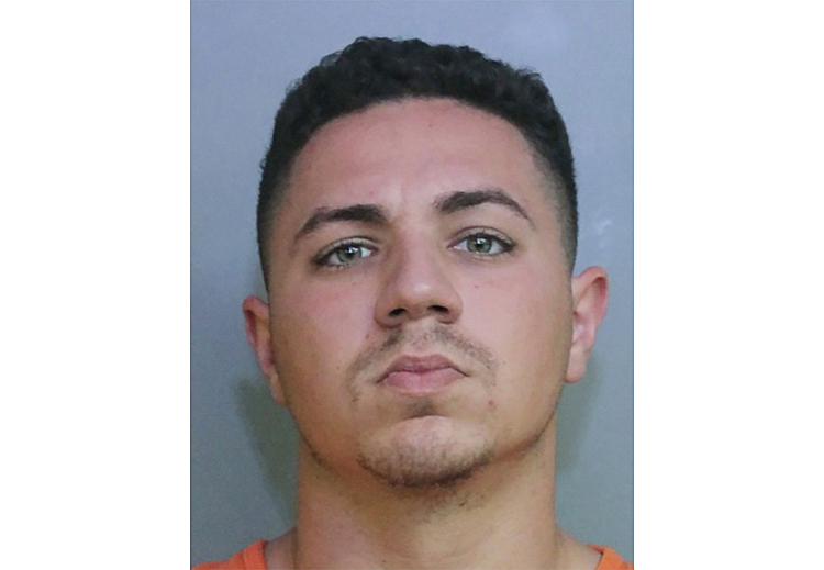 Florida officer charged with murder after inmate's death