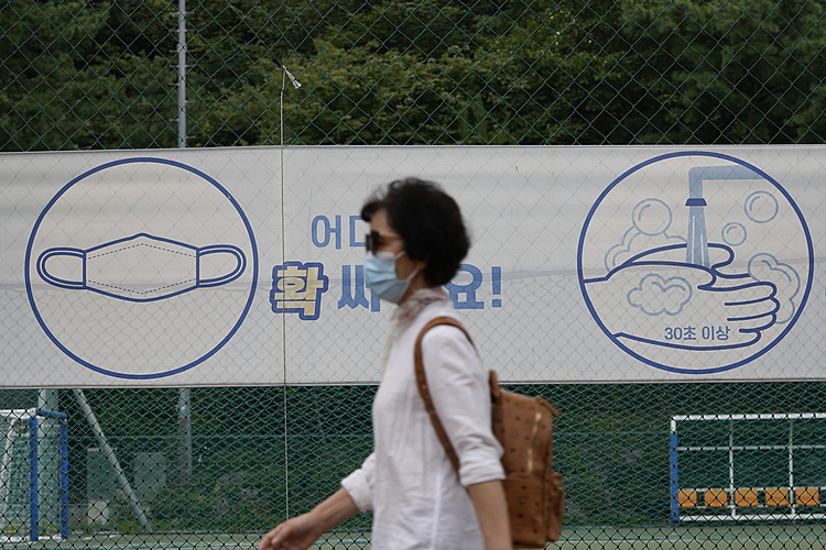 The Latest: Virus rules in Seoul extended another month