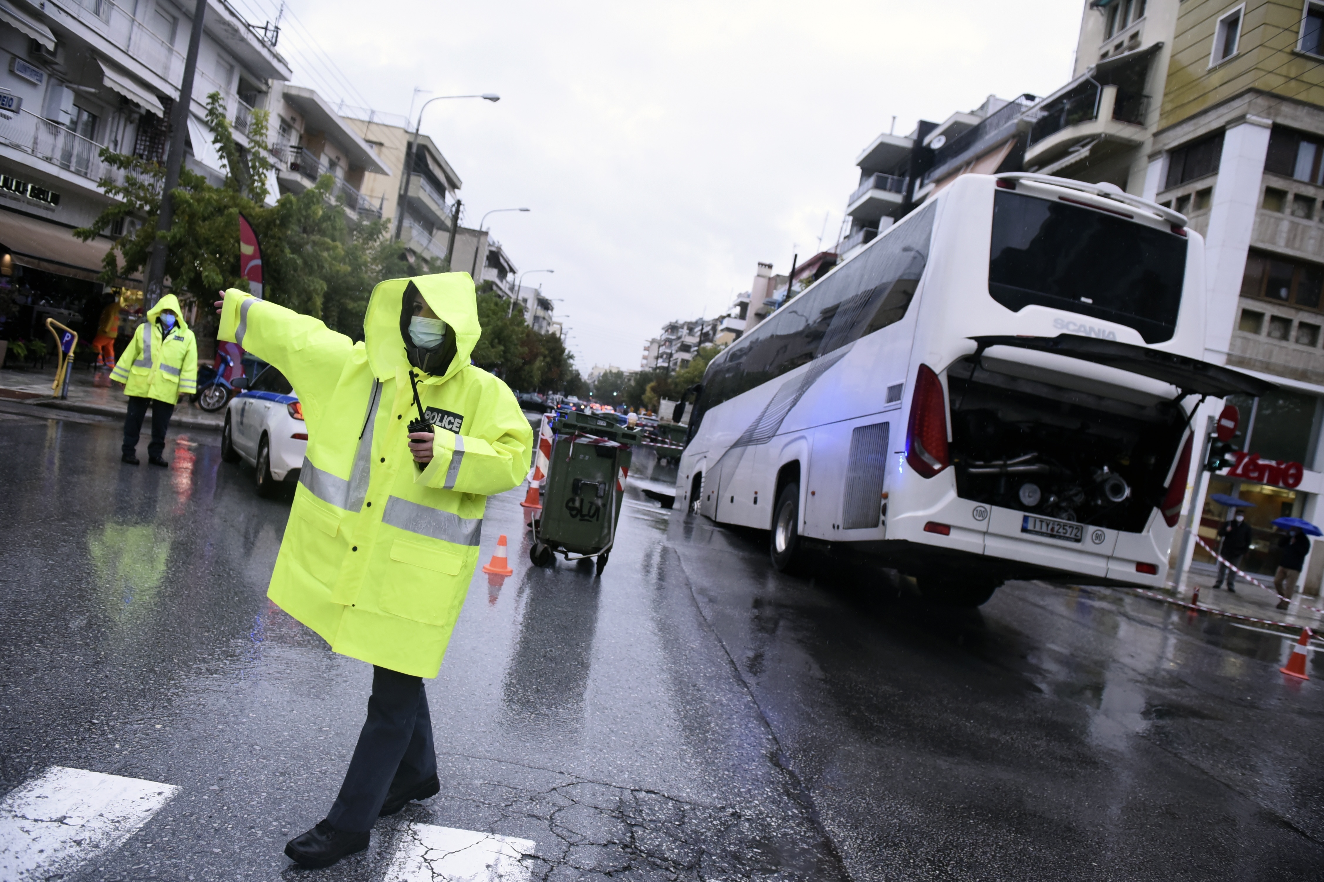 Bus tips into sinkhole as deadly storms lash Greece  