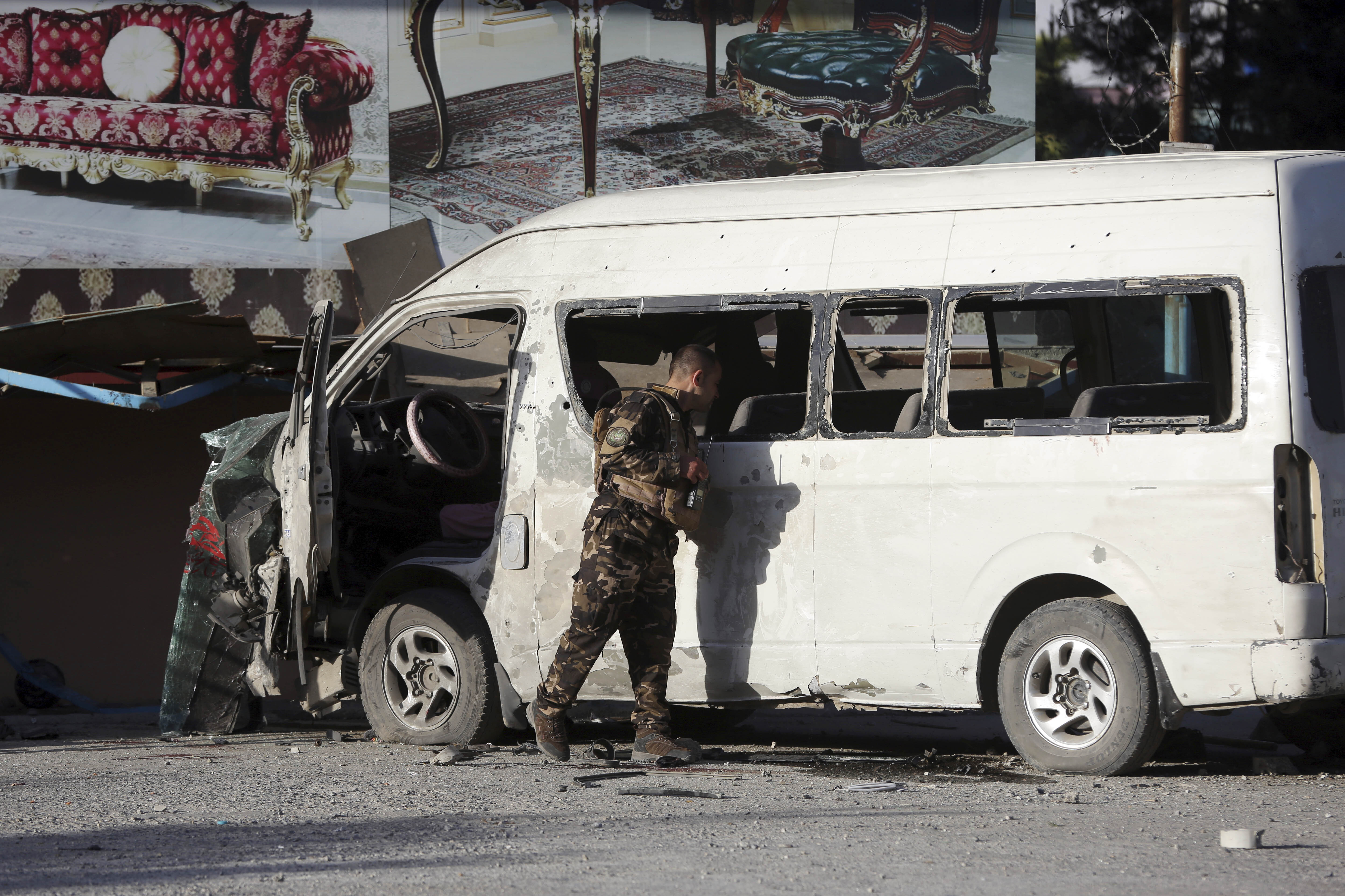 Official: Bomb in Afghan capital targeted TV bus, 2 dead