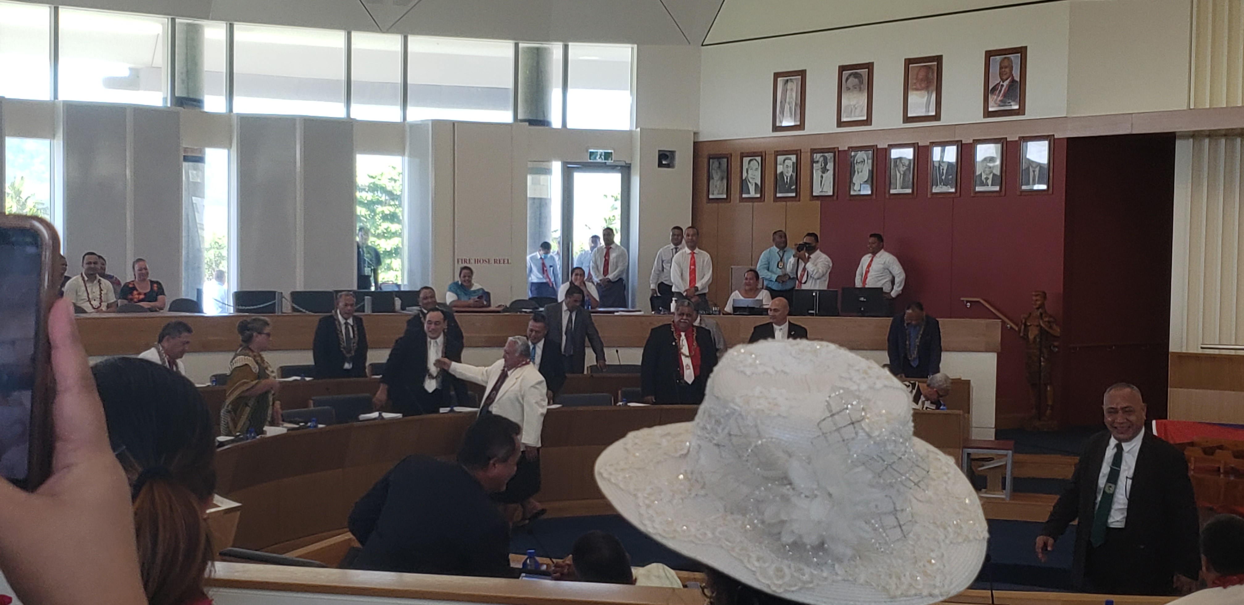Political rivals shake hands, hug before swearing-in