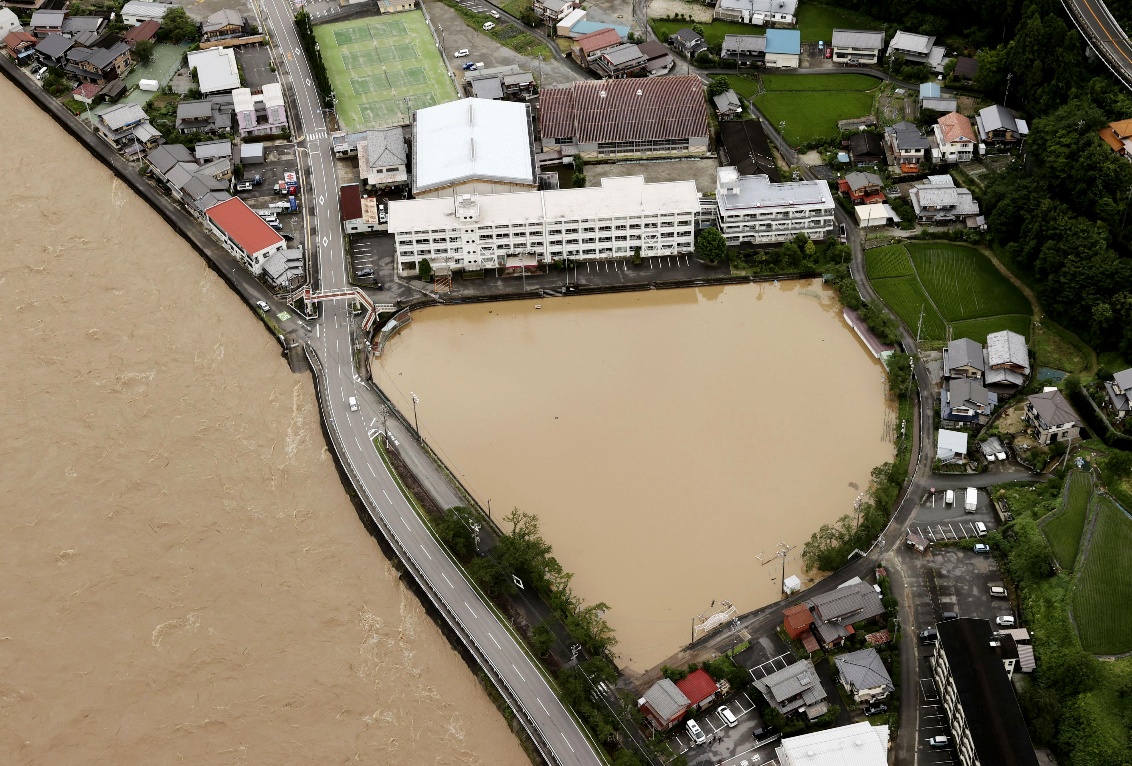 Japan battered by more heavy rain, floods, nearly 60 dead