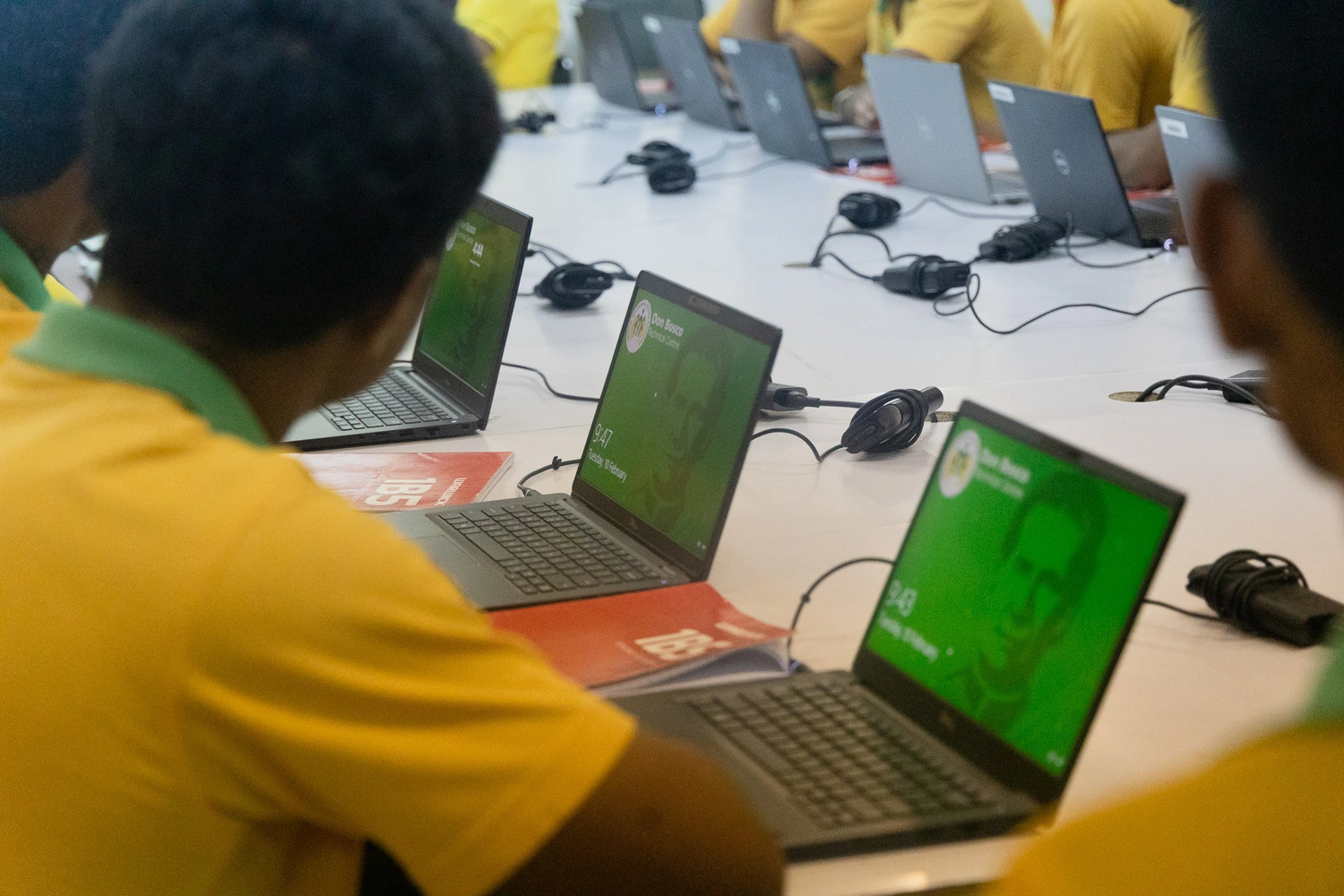 Don Bosco get 54 laptops, minister donates his EV