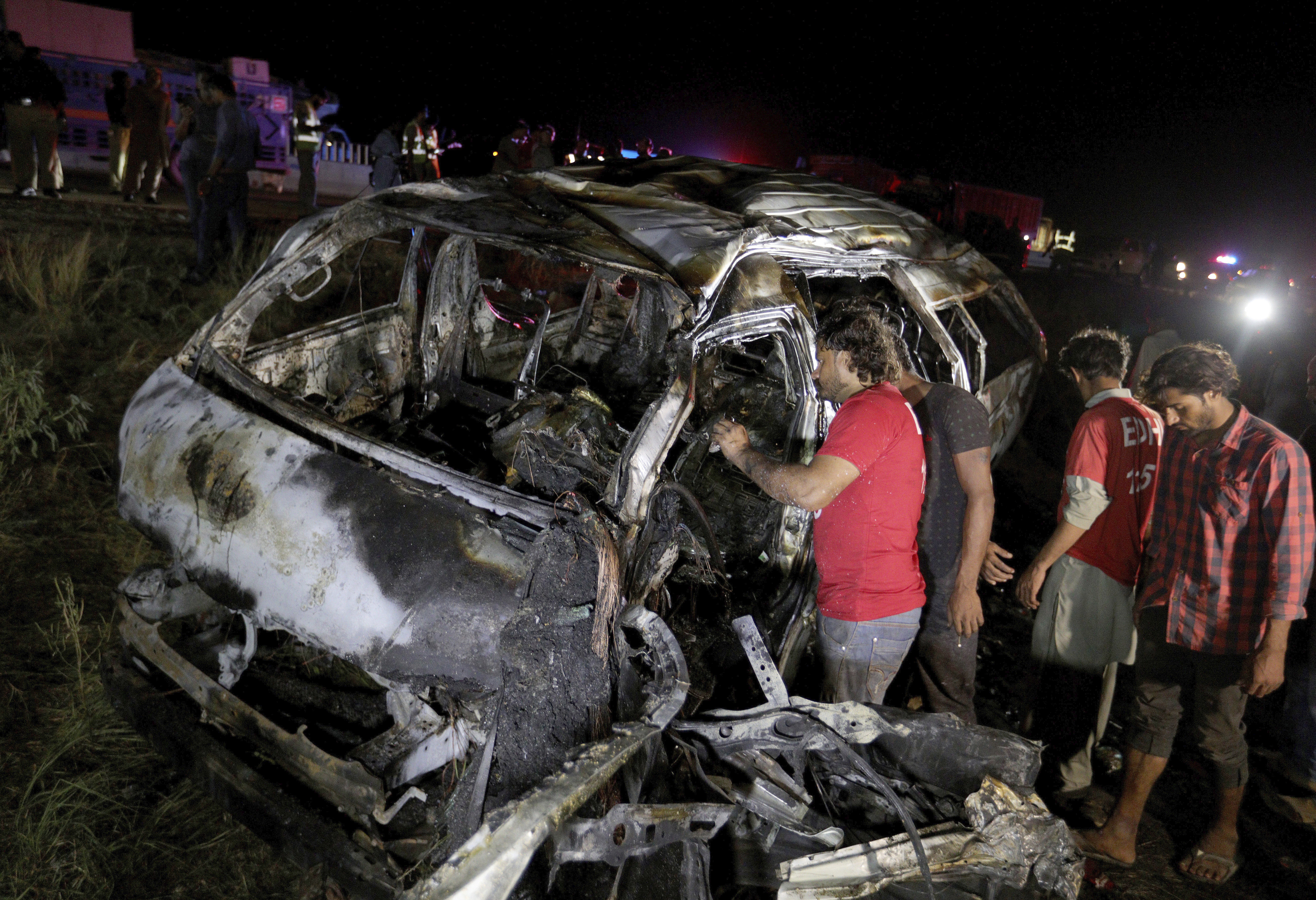 13 killed in van fire on highway in southern Pakistan 