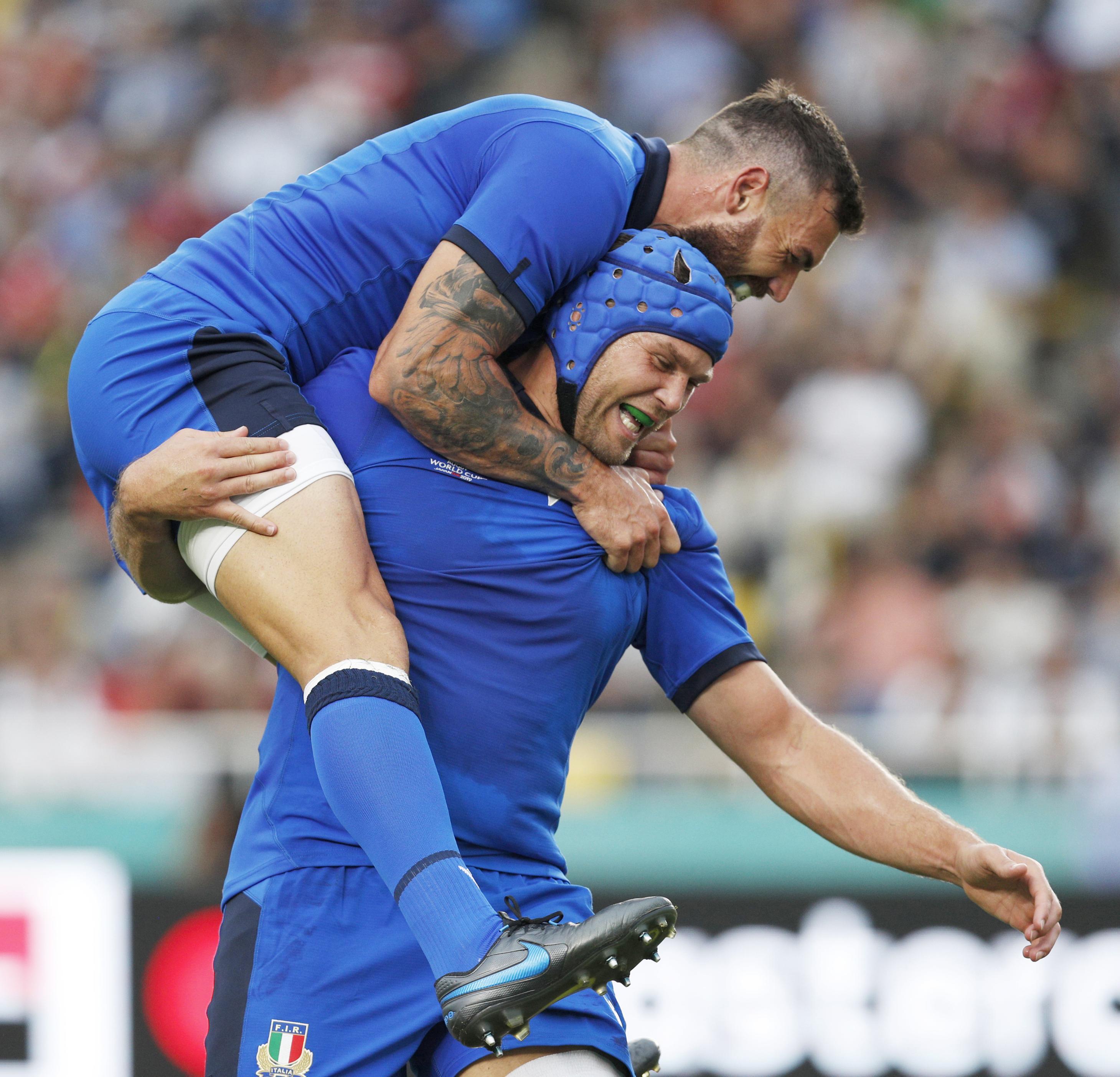 The Latest: Italy beats Canada 48-7