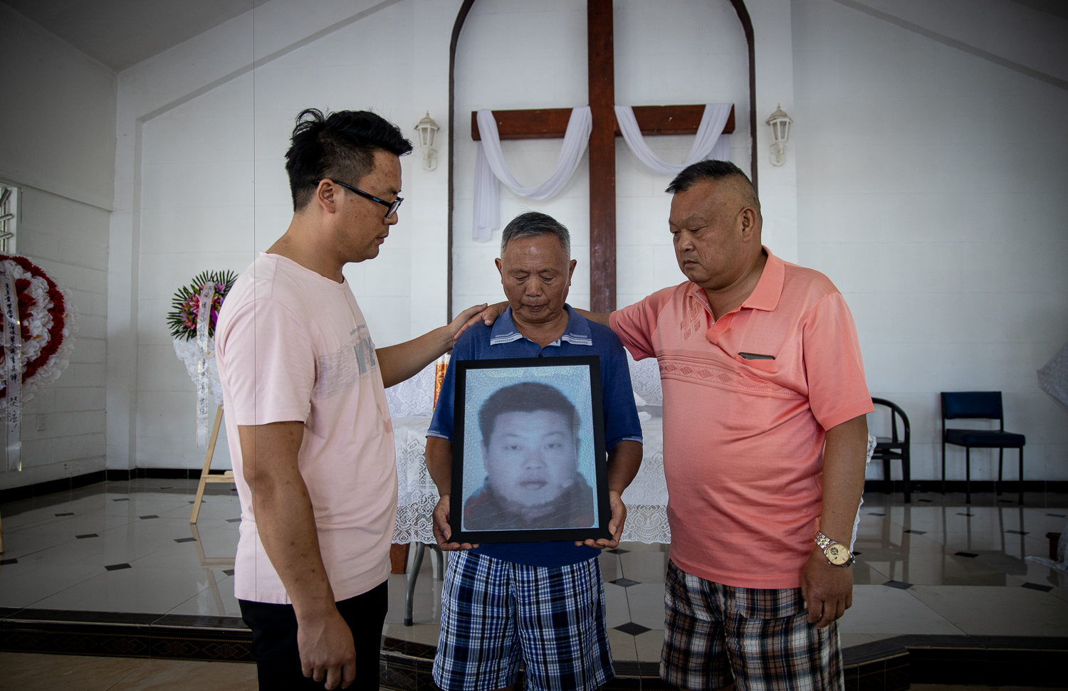 Family of slain Chinese man mourn their loss
