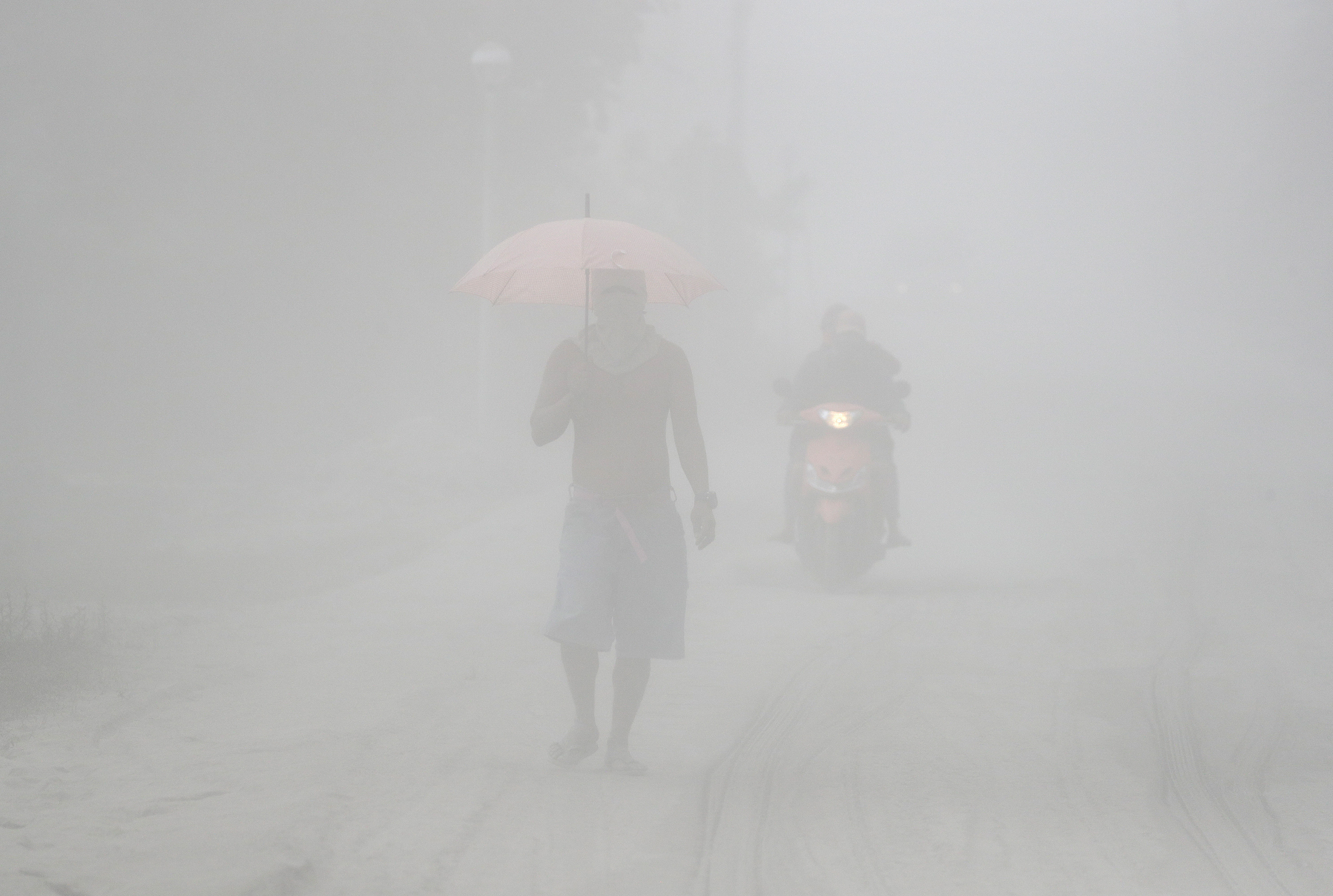 AP Photos: Taal volcano emits ash, threatening more eruption
