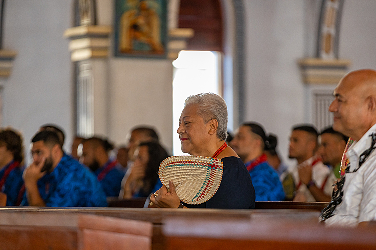 M.F.A.T. official assists Fiame in N.Z.