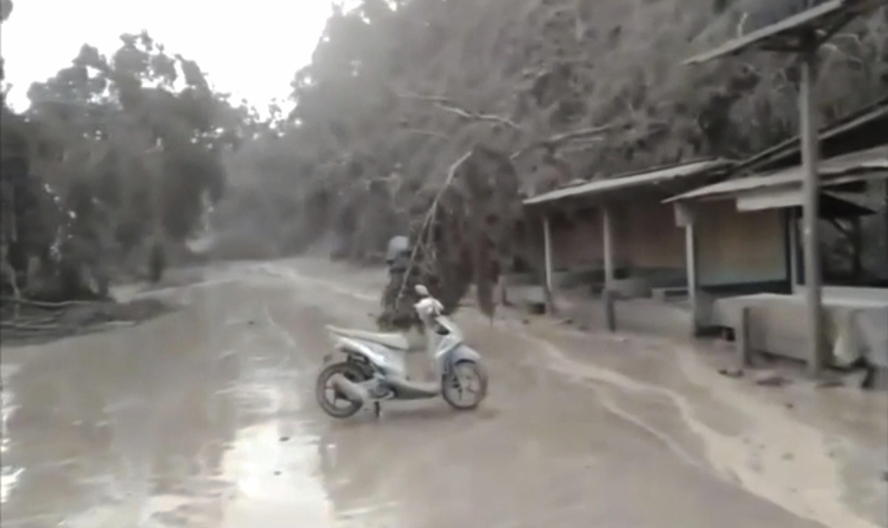 Indonesia's volcano spews ash, gas; 1 dead, dozens hurt