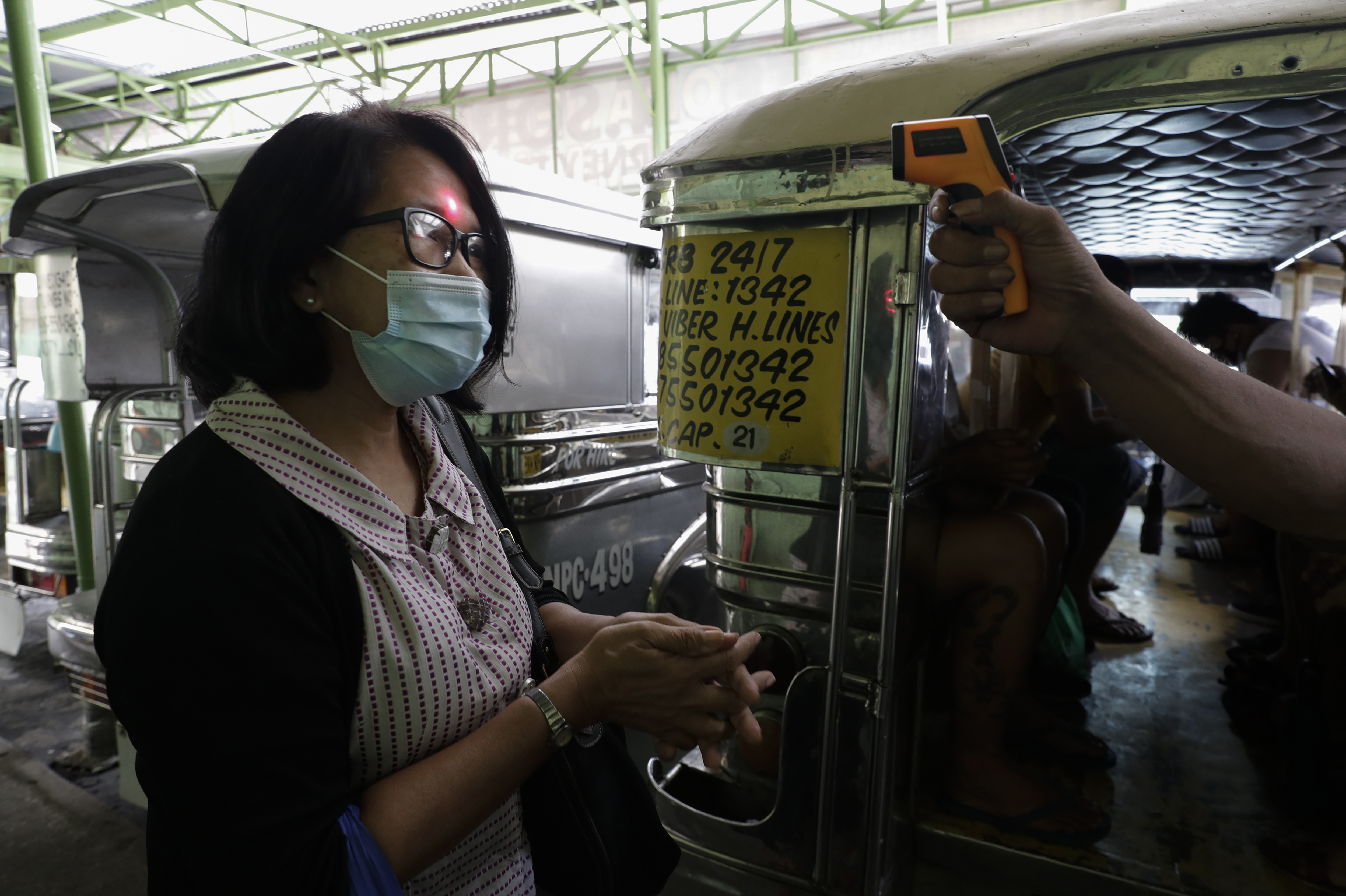 The Latest: Philippines coronavirus cases top 100,000