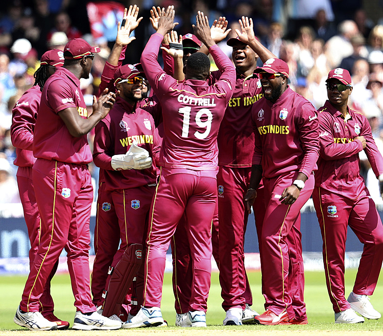 Cricketer's army salute becoming image of World Cup