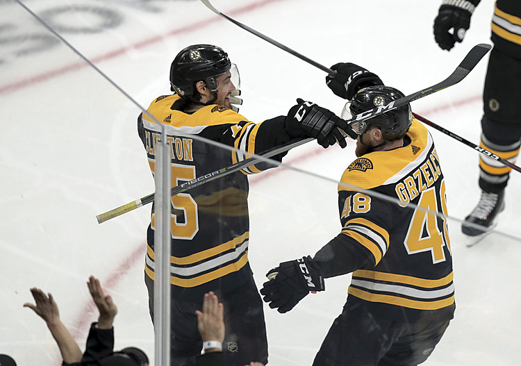 The Latest: Boston defensemen lead charge in Game 1