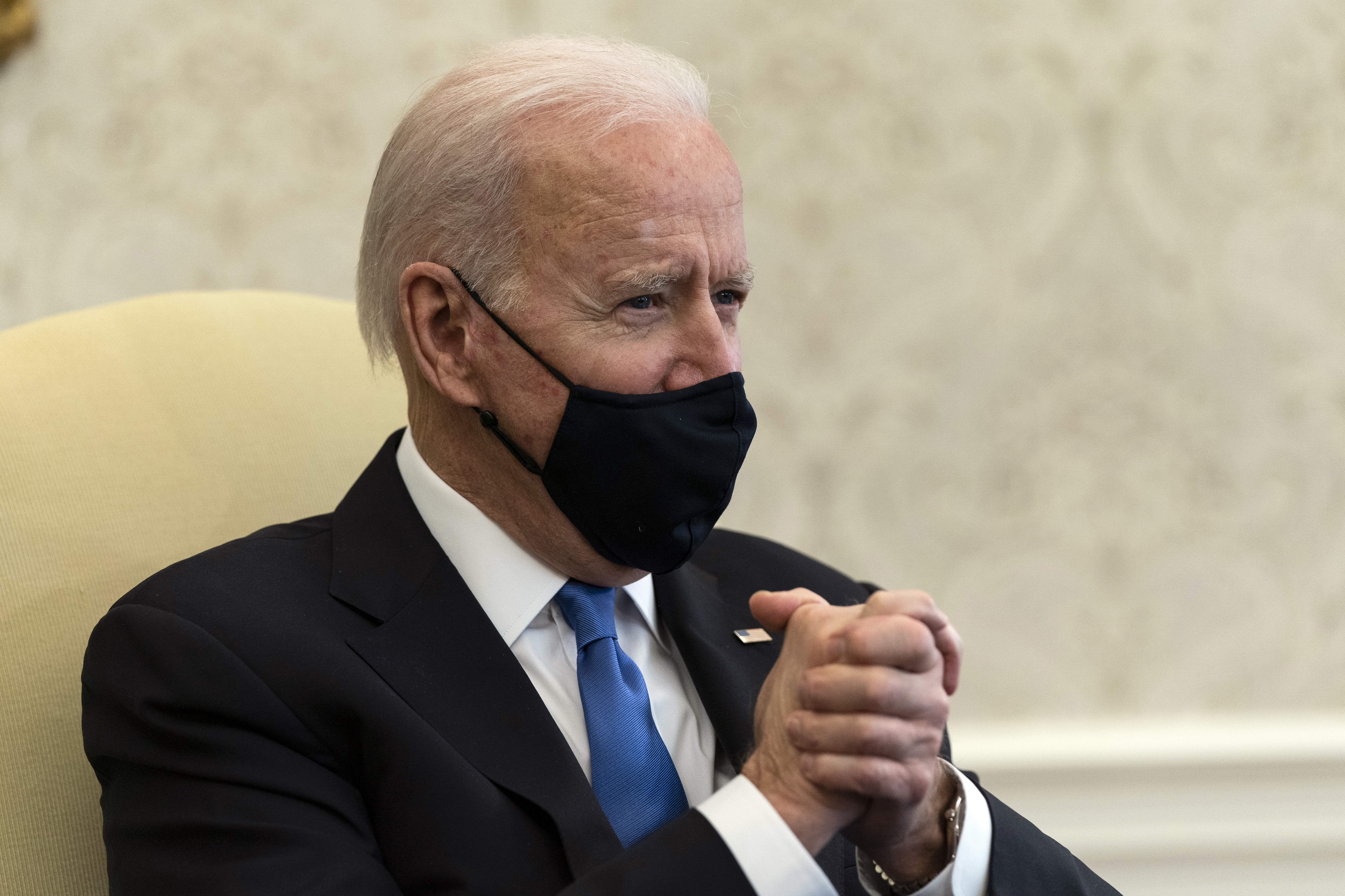 The Latest: Biden: 'Big mistake' by states to drop mask rule