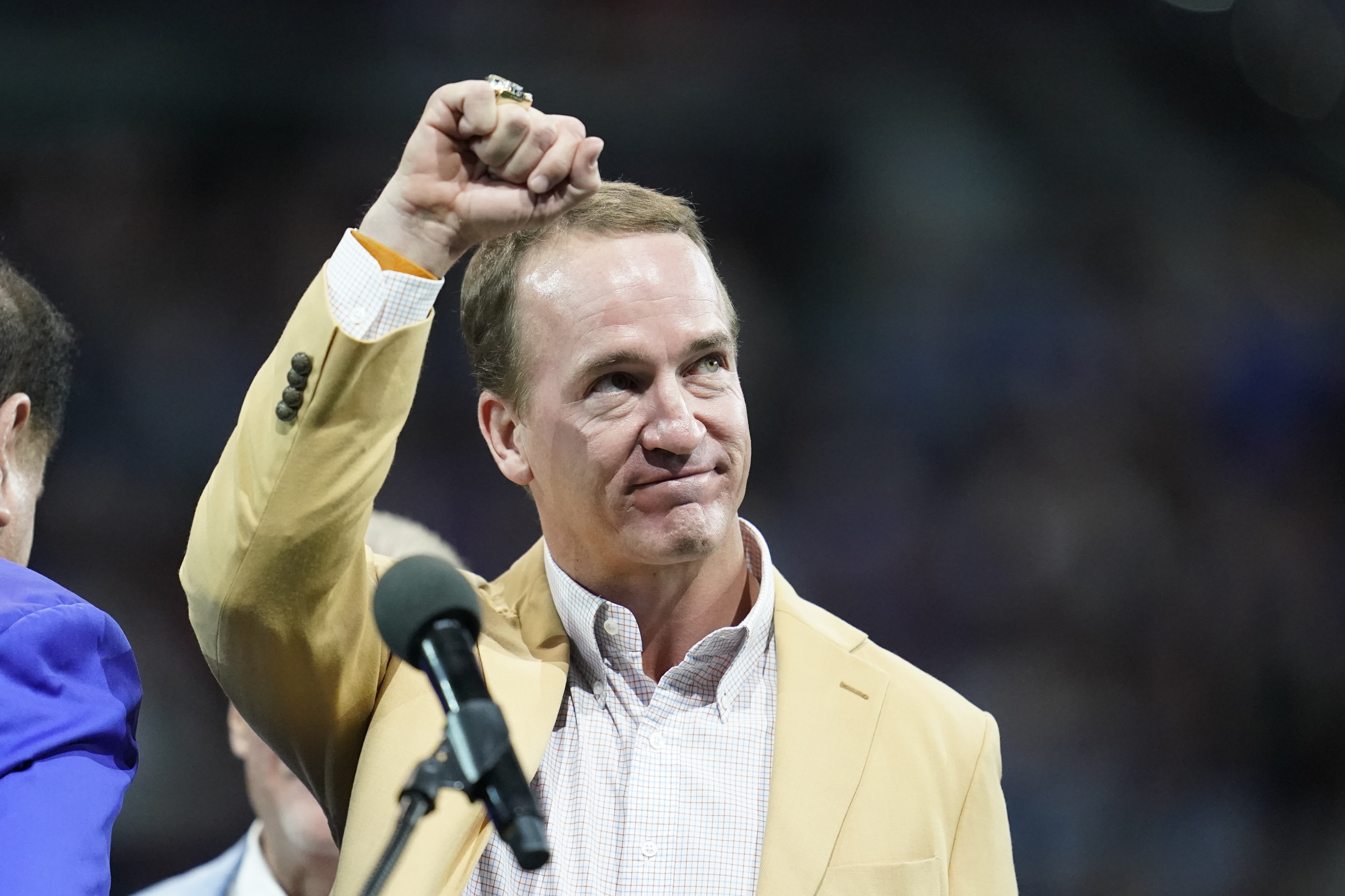 The Latest: Colts legends Manning, James receive HOF rings