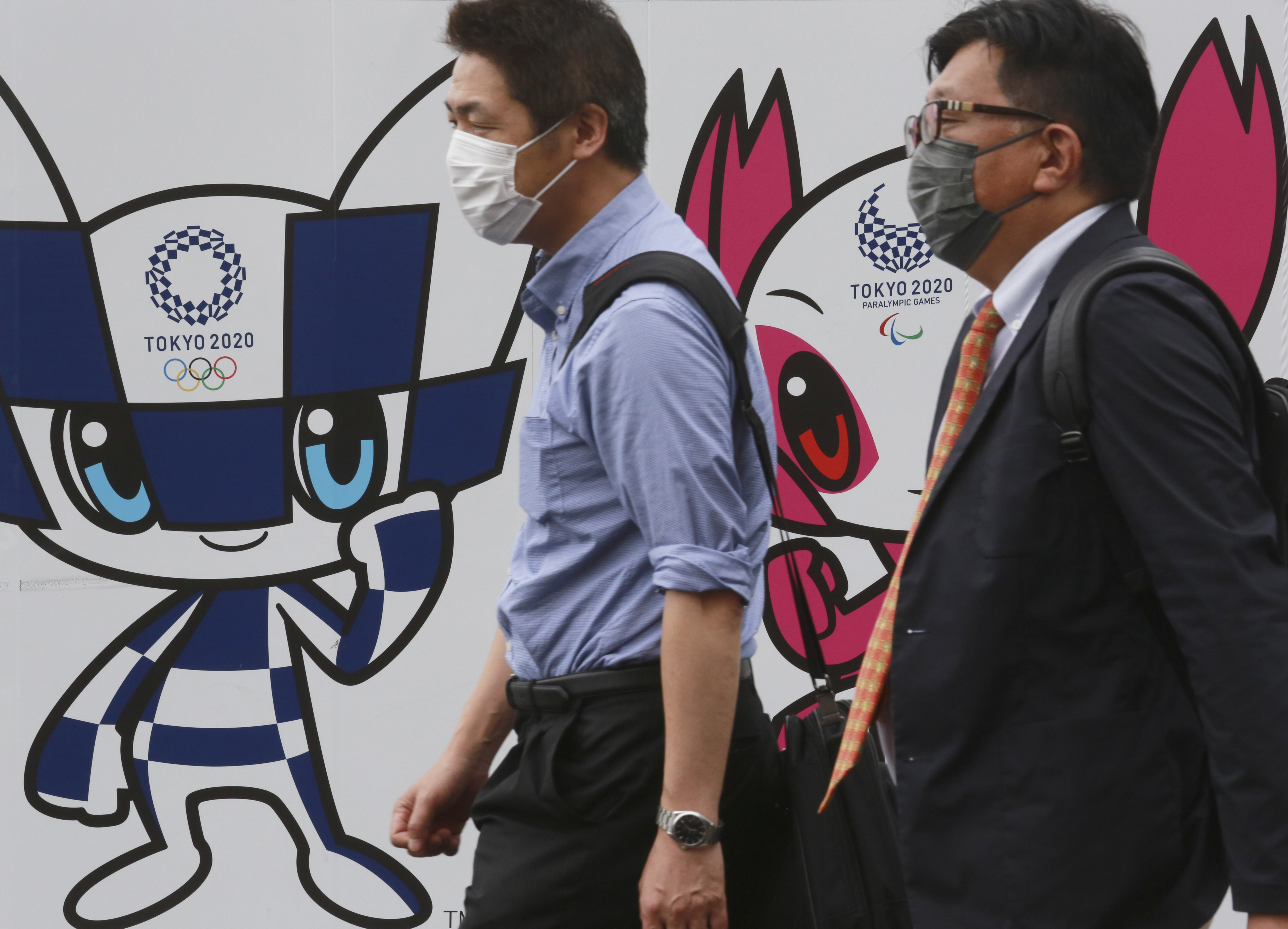 The Latest: Japan eases virus emergency ahead of Olympics
