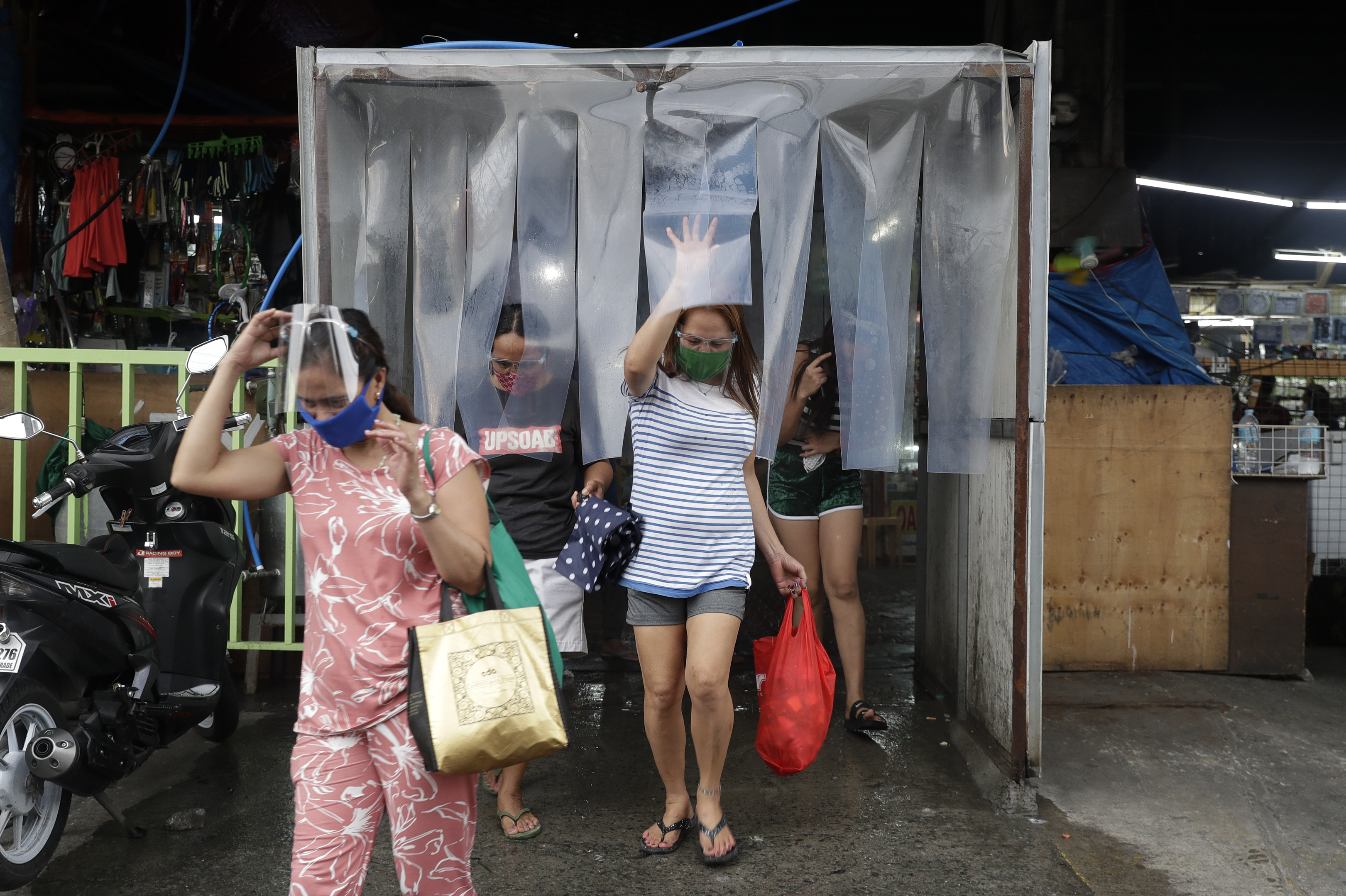Asia Today: Manila back under lockdown as virus cases surge