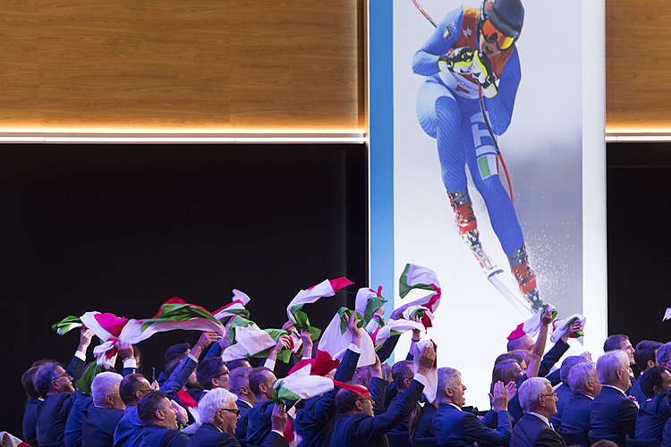 The Latest: Milan-Cortina wins bid by 47-34 votes