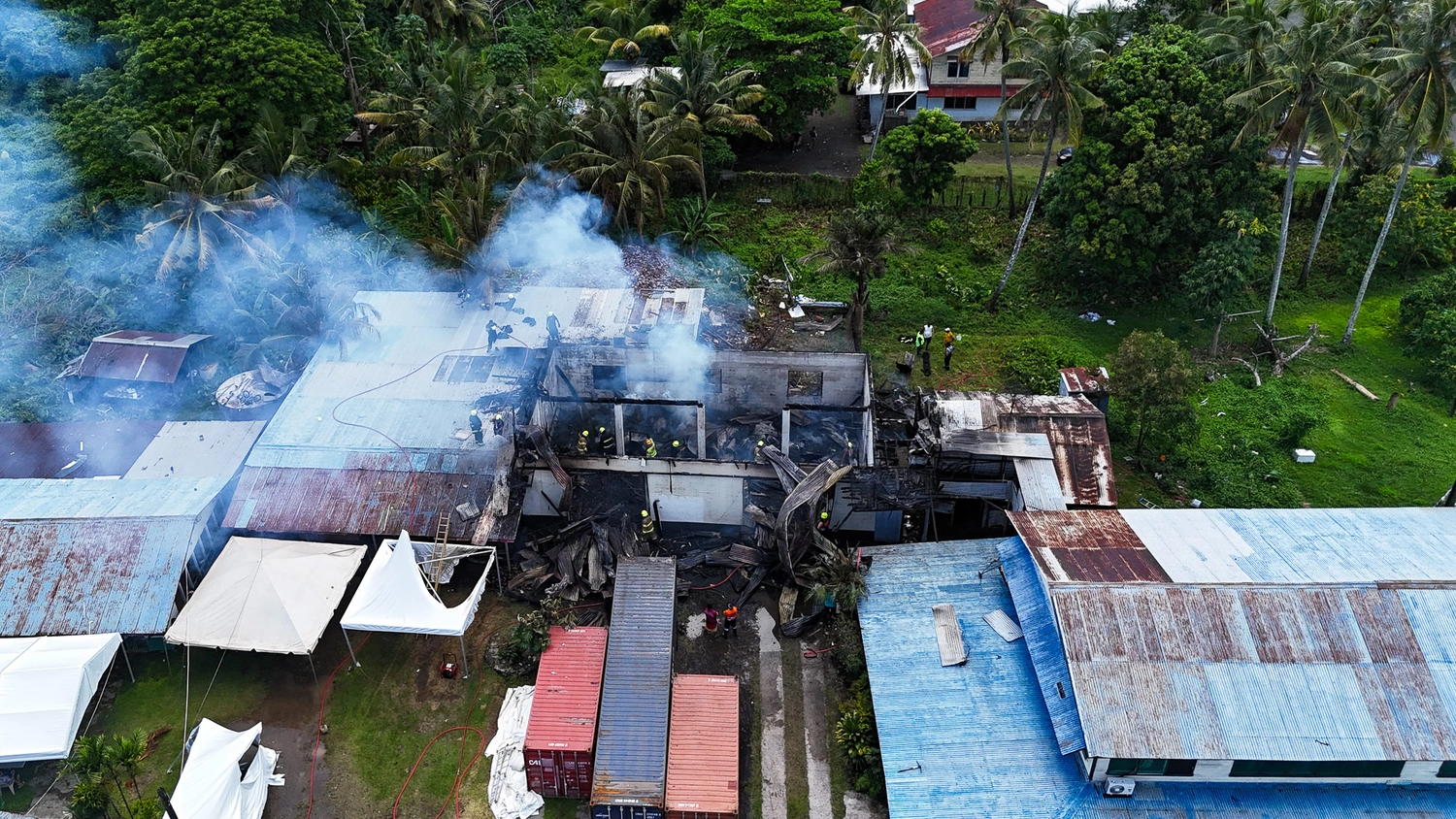 Brave effort, firefighters save building, home destroyed