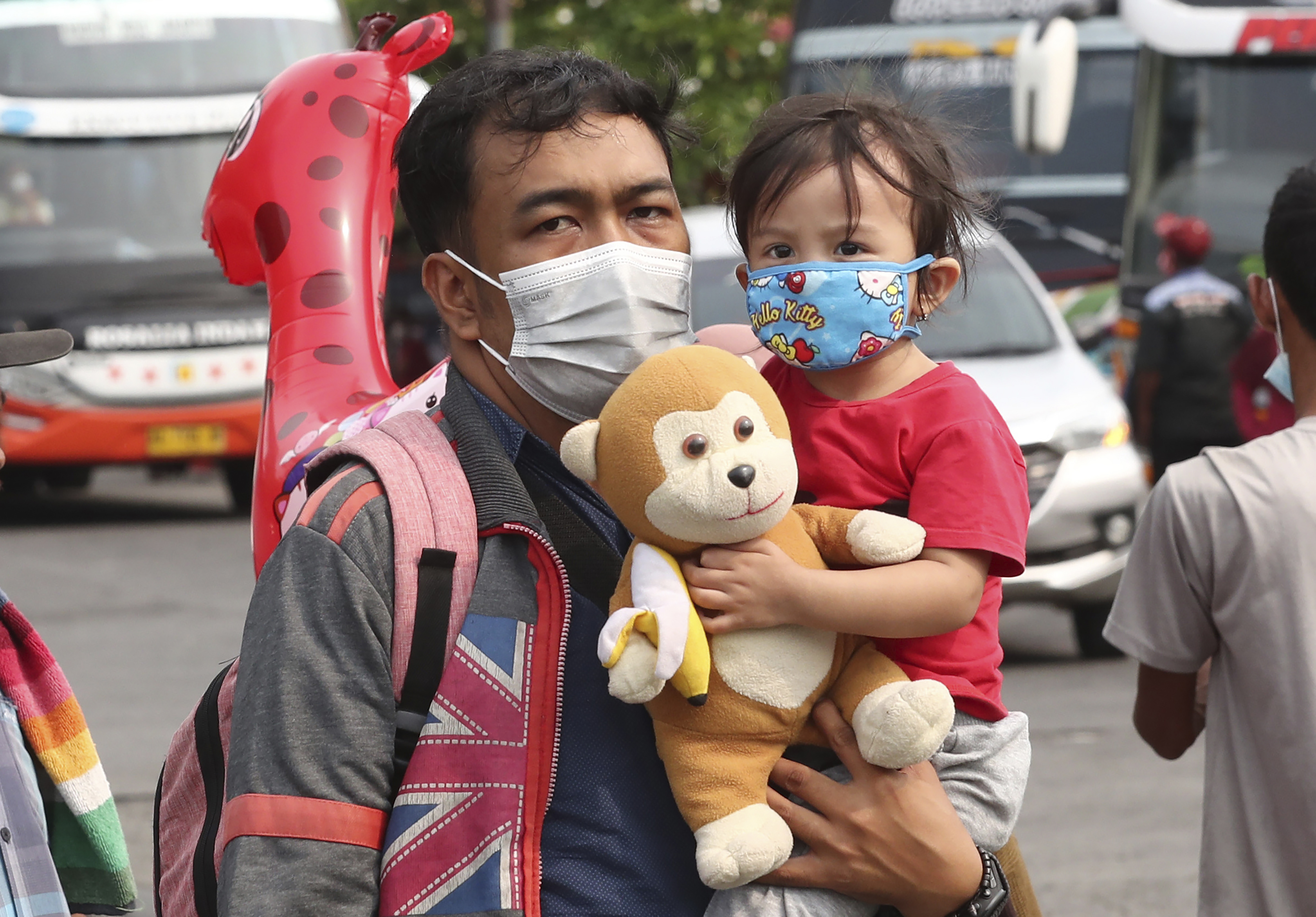 The Latest: Indonesia bans traveling home for Eid al-Fitr