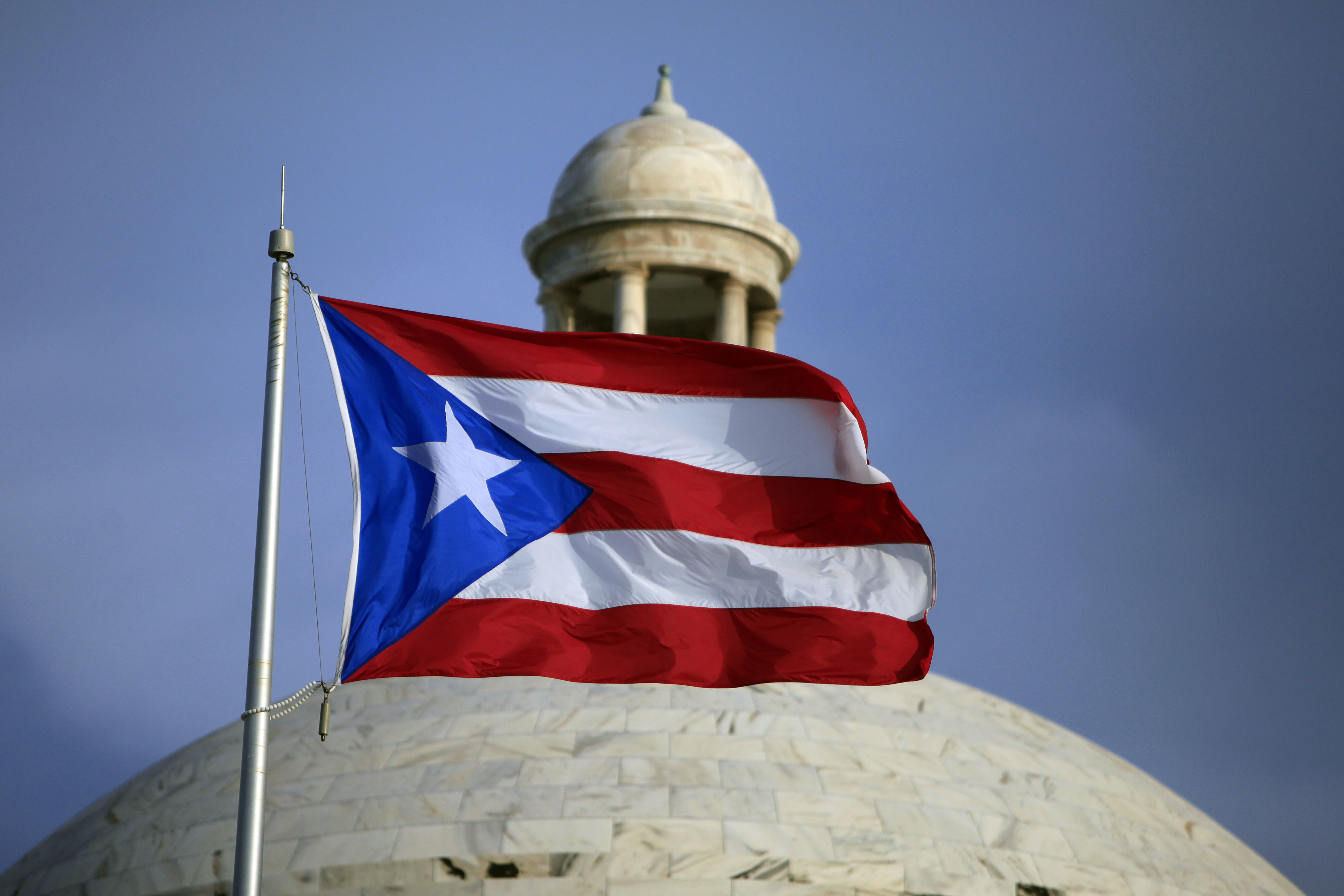 Puerto Rico board approves $10B budget as resignations loom