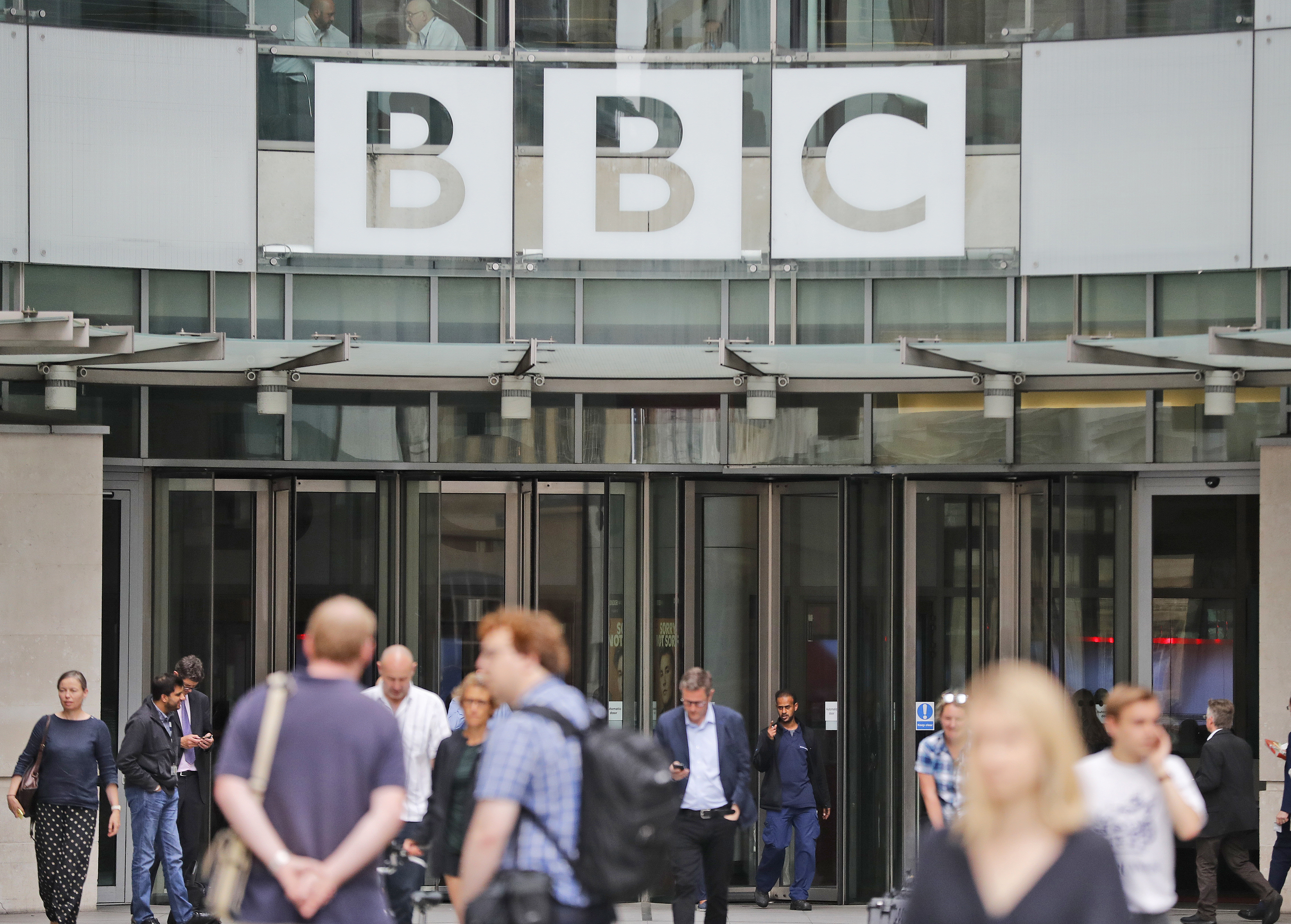 UK government, at odds with media, eyes BBC funding change