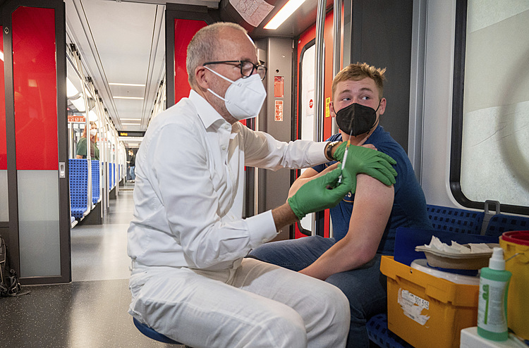 The Latest; Germany offers transportation for vaccinations