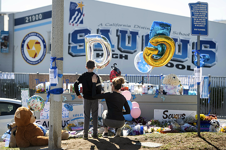 Students retrieve their belongings after California shooting